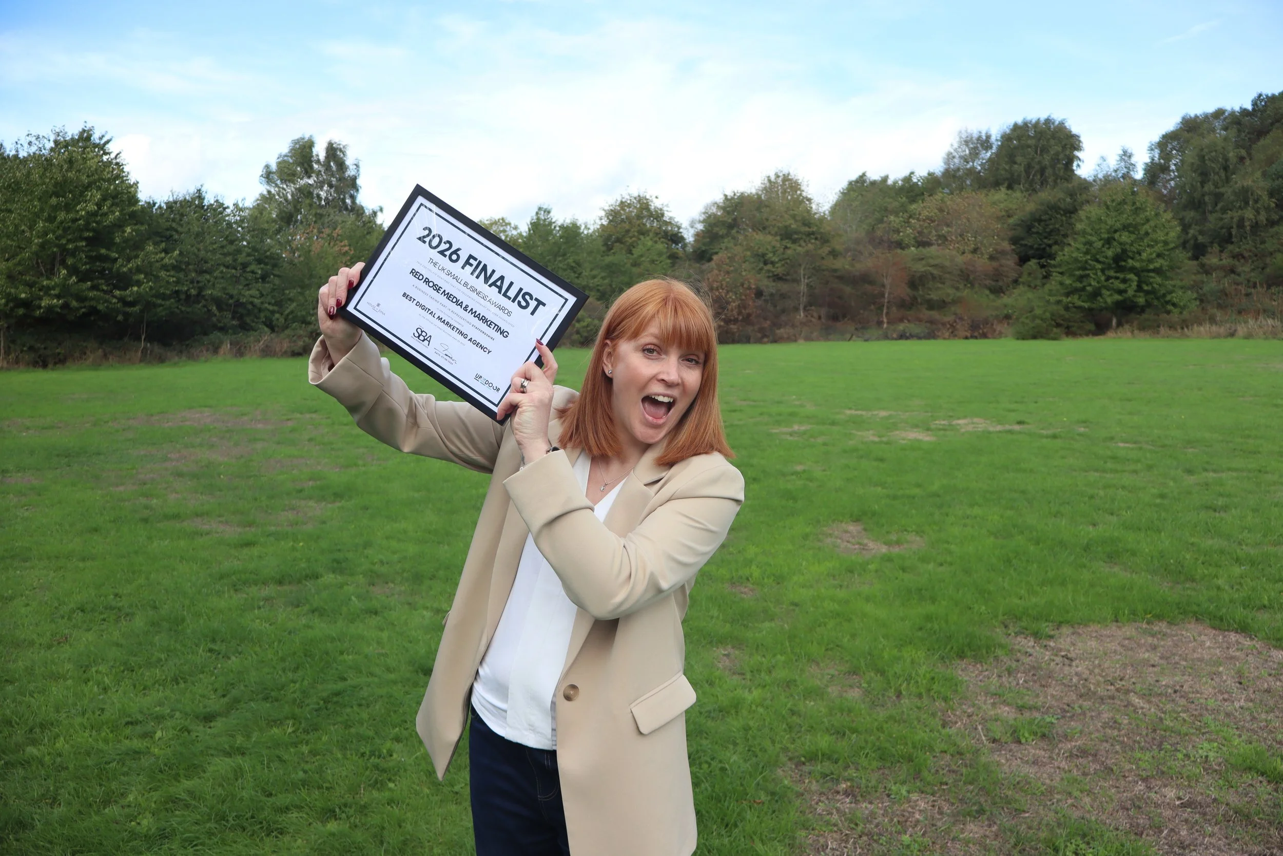 Penny smiling holding up finalist certificate