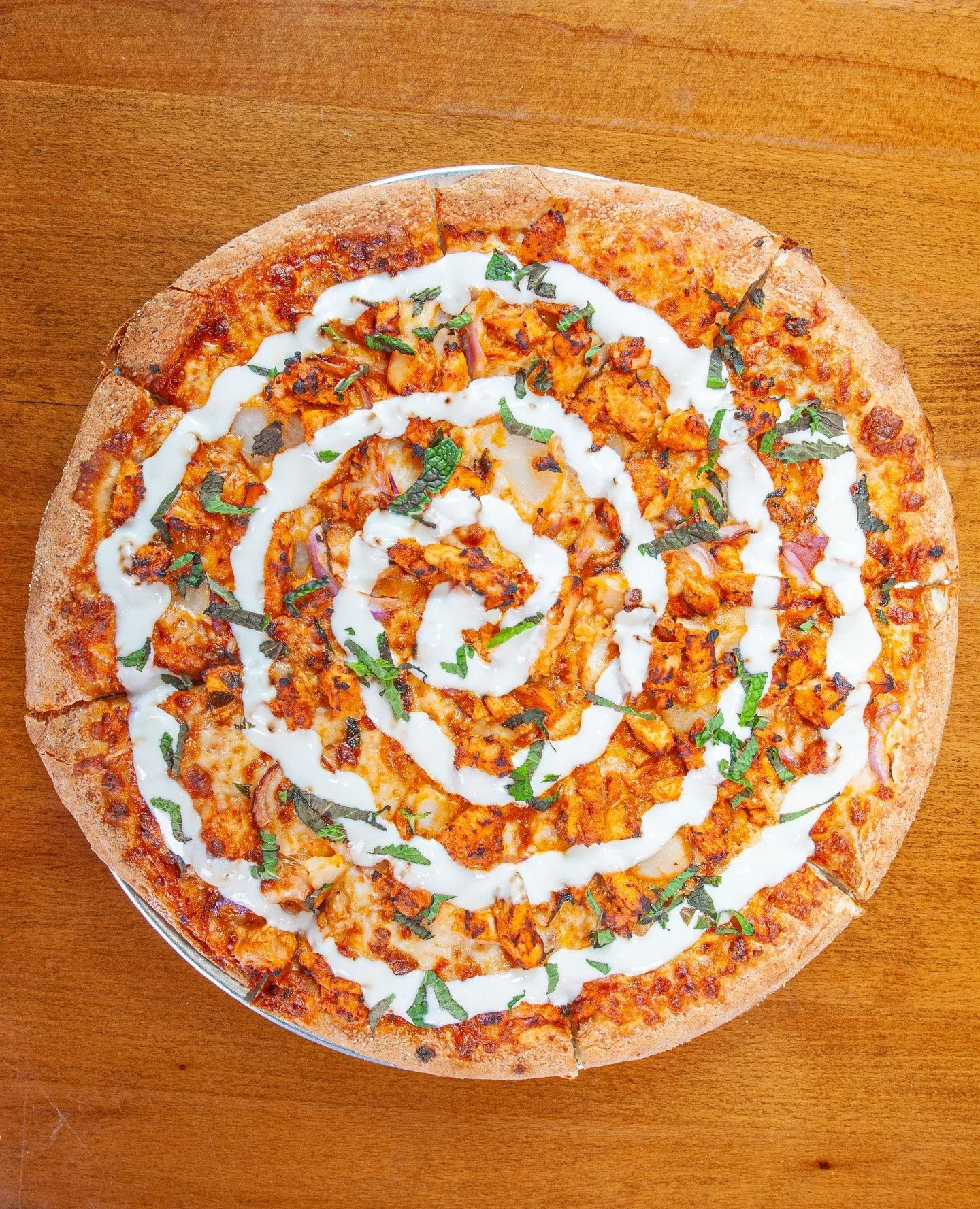 Butter chicken on pizza&hellip; are you in?!⁠
⁠
Our Masala Butter Chicken pizza brings is full of rich, savory goodness with tender chicken in a rich masala sauce, mozzarella, garlic, red onion, crisp water chestnut, fresh mint, and a yogurt drizzle.