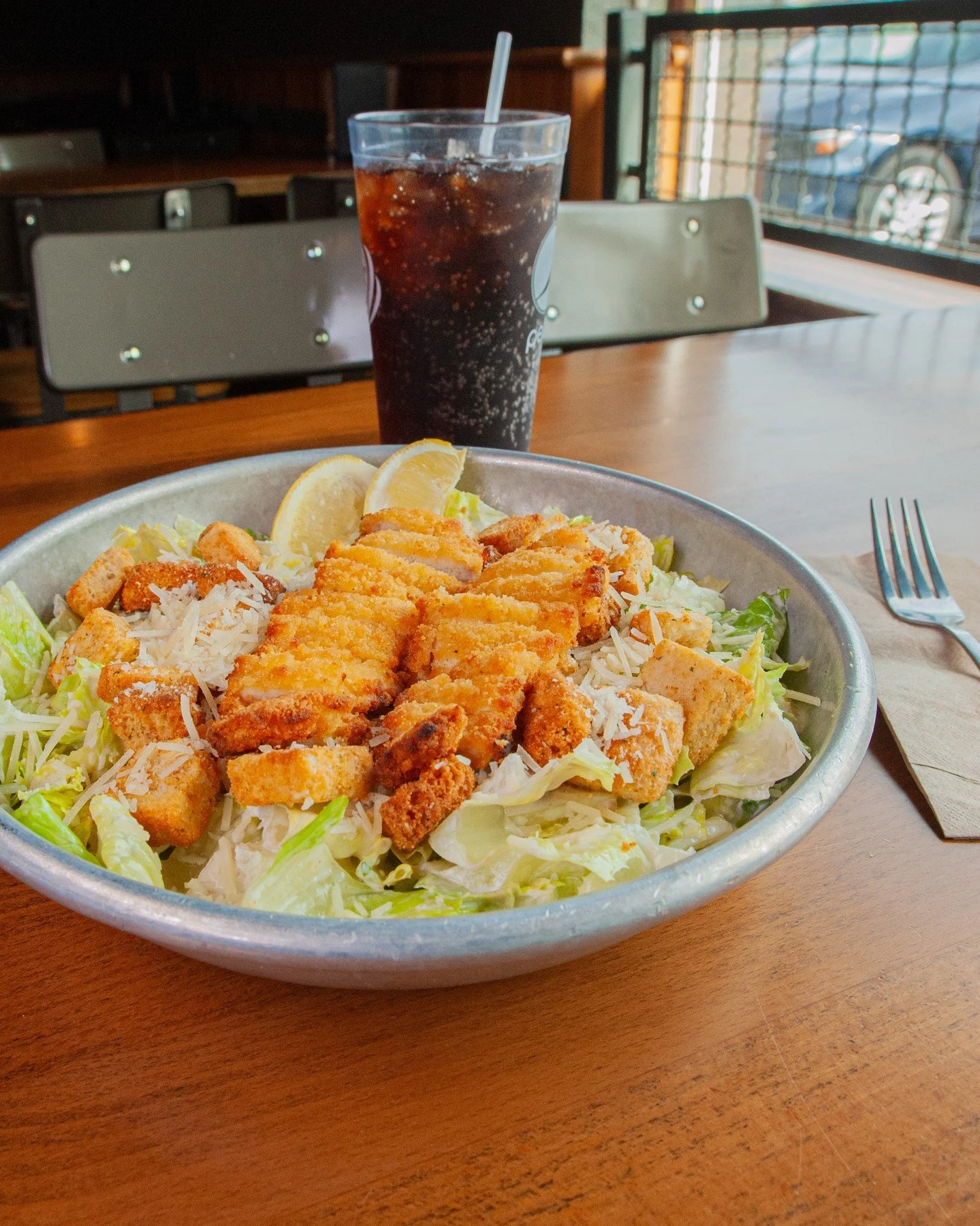Ring ring, lunch is calling 📞✨ Pull up from 11am&ndash;3pm daily and snag one of our lunch specials, like the Chicken Caesar Salad. It's $14 and comes with a fountain drink.