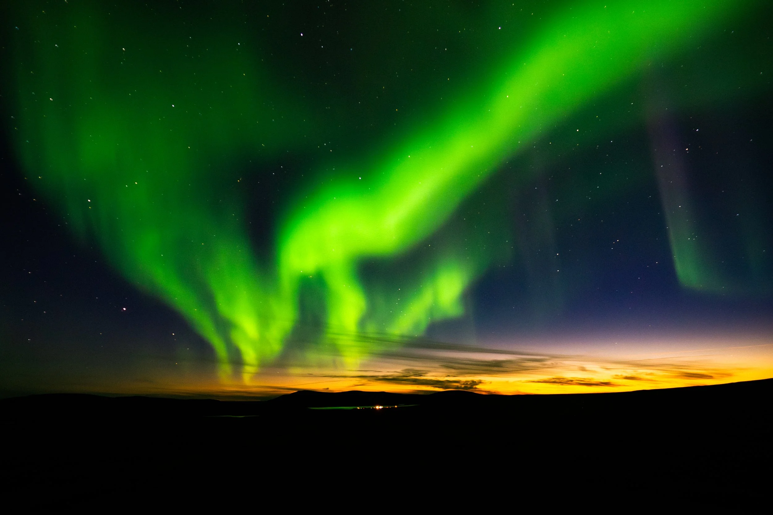Aurora over a 1 am sunset is about as surreal as it gets