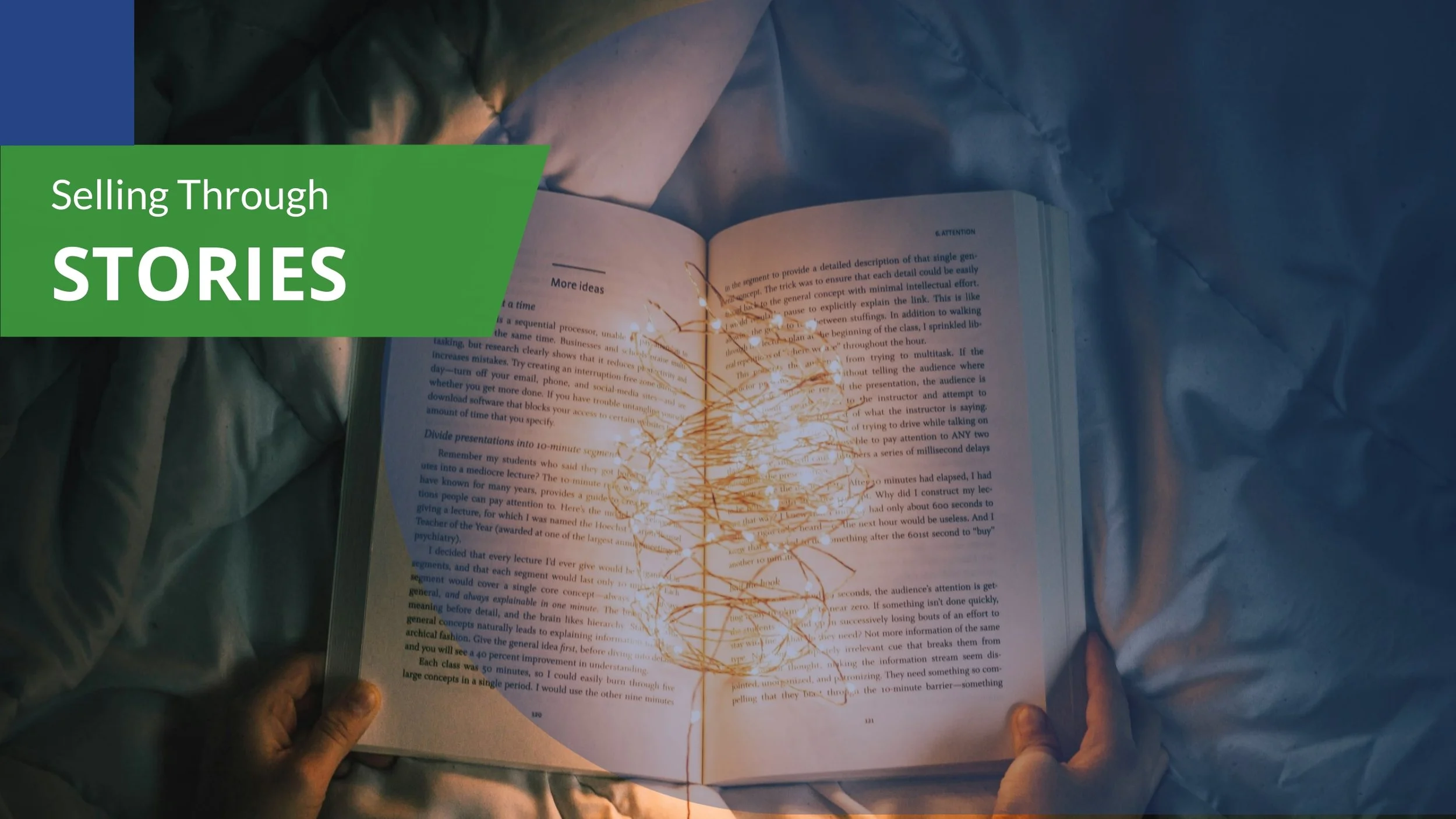 Open book on crumpled paper, with a string of lights shaped like a tree over the pages, and a green banner with white text that says 'Selling Through STORIES' on a blue background.