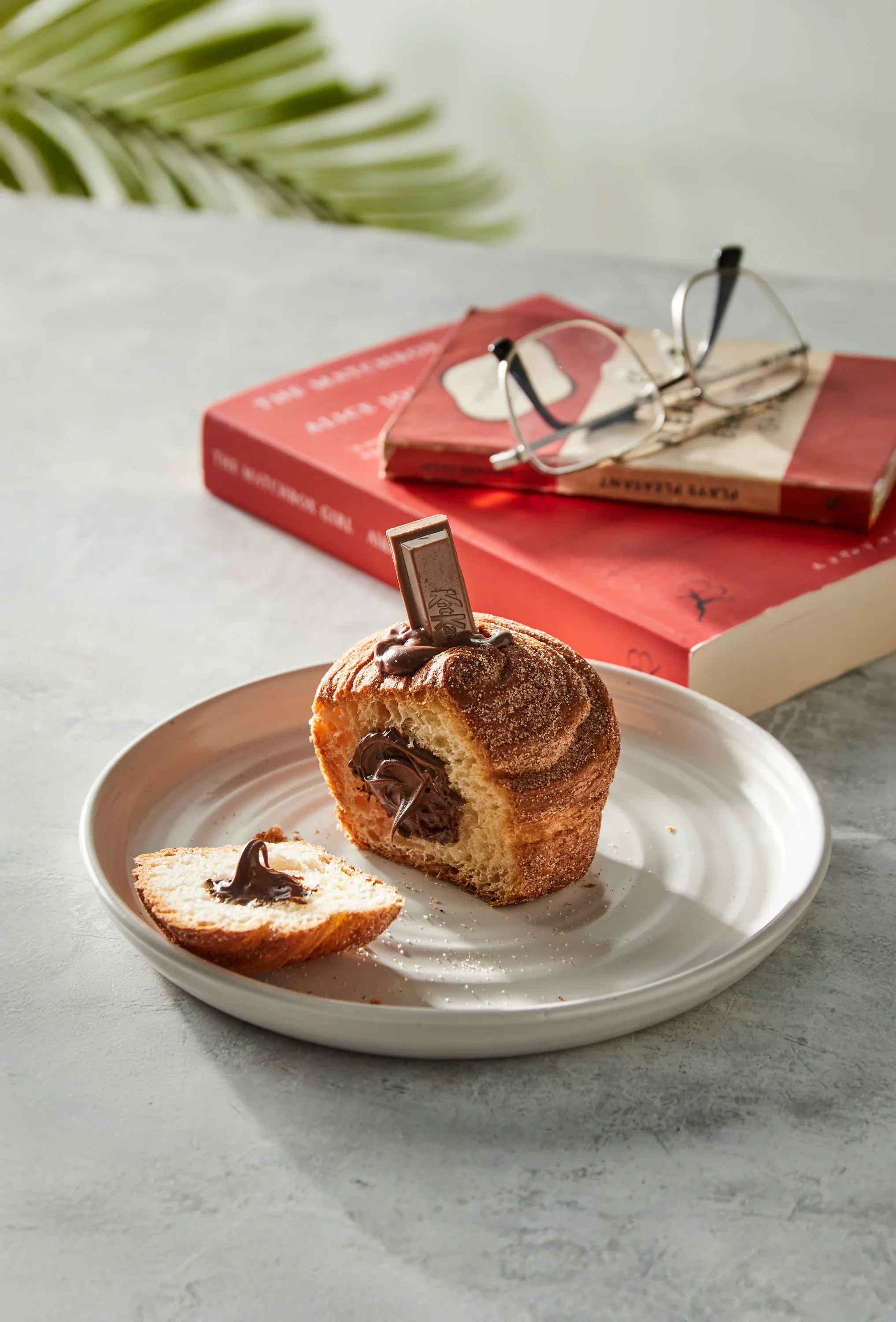 KK_CRUFFIN_CUT_IN_HALF_READING_BOOK.webp