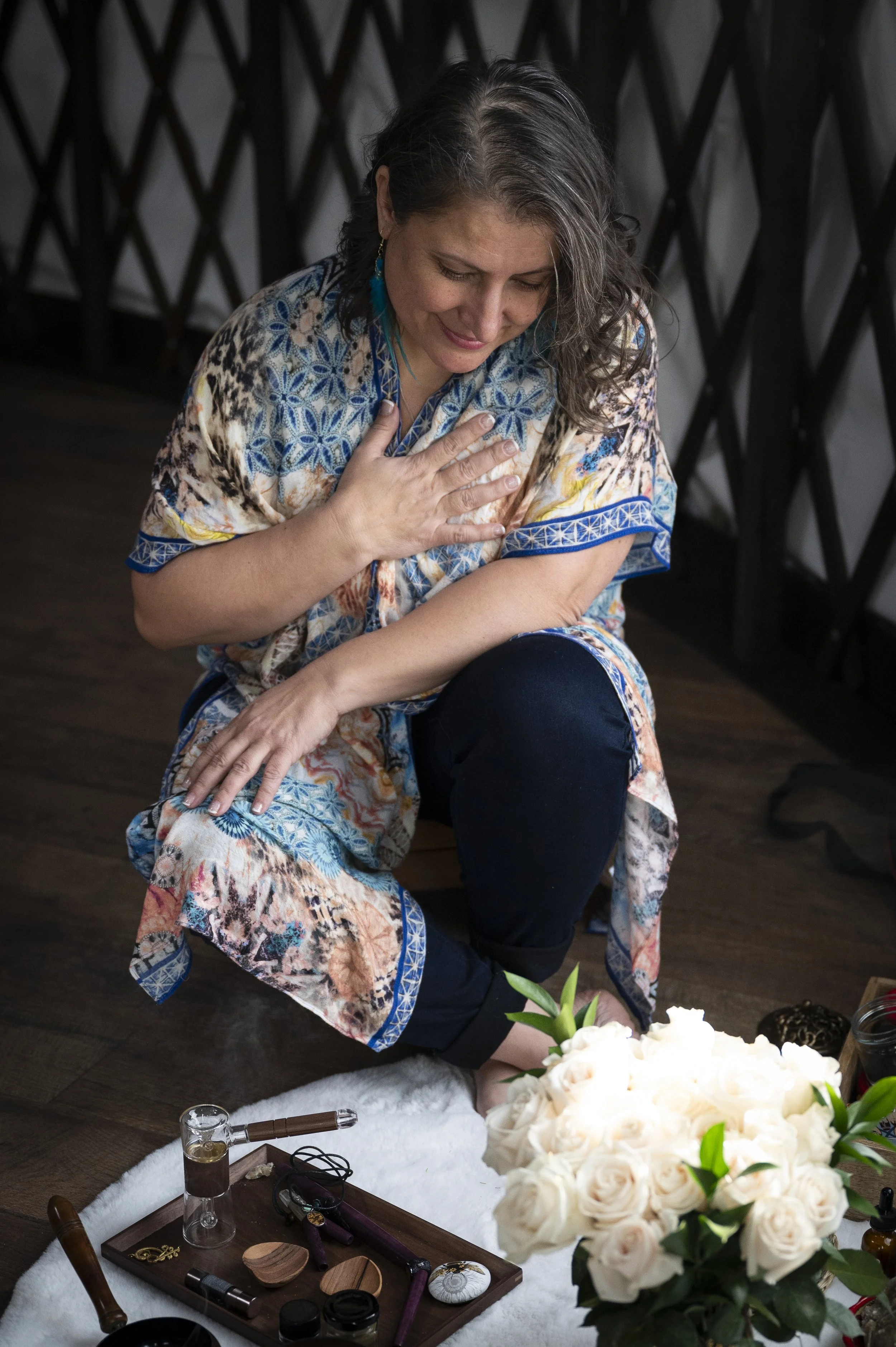 Woman with her hand on her heart, setting an intention for healing