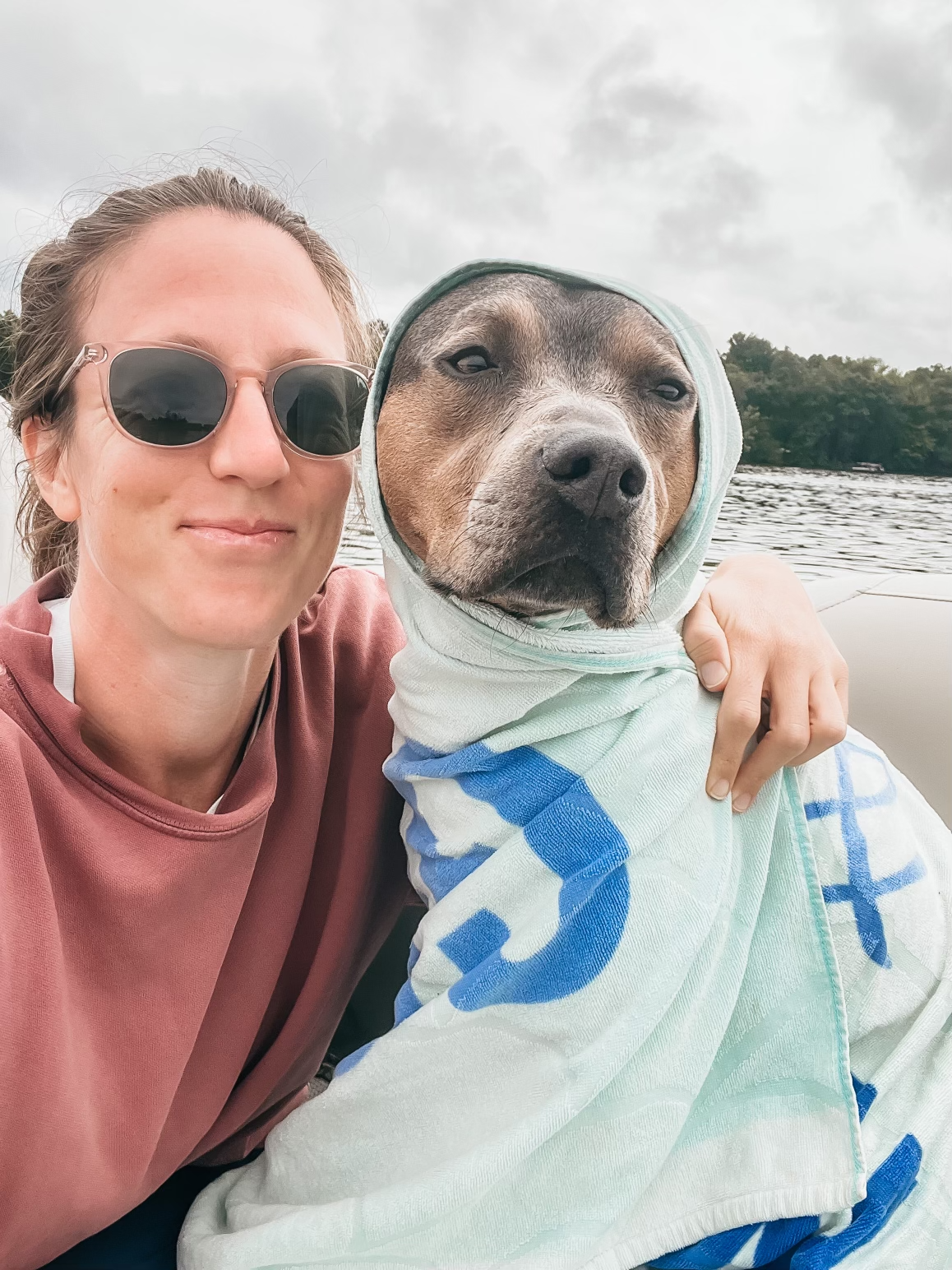 Dr. Elizabeth with Luna bundled in a towel, featured in a wellness blog about organ systems, body awareness, and intuitive healing.
