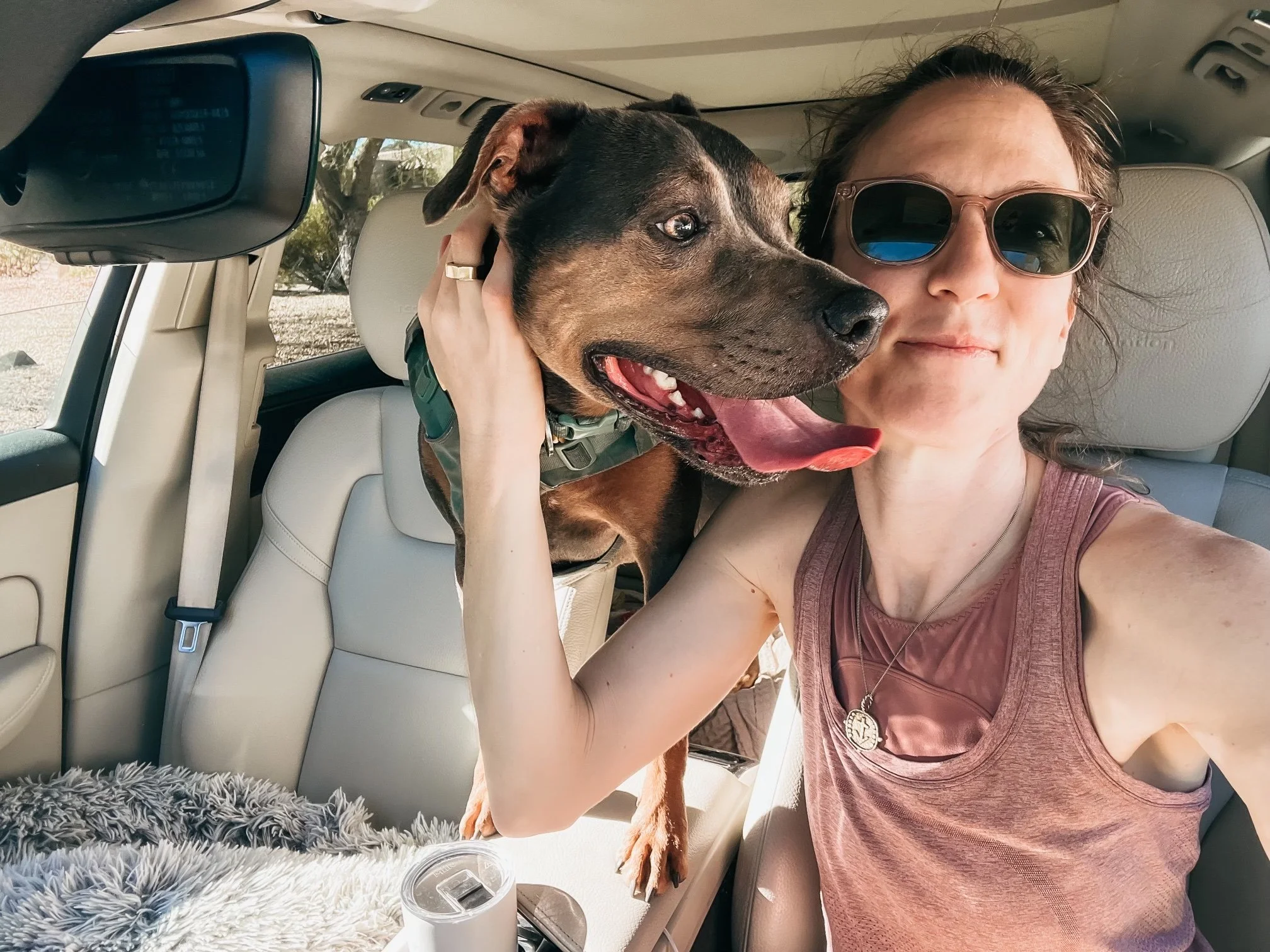 Dr. Elizabeth with her dog Luna after a hike, representing the nonlinear process of healing and nervous system regulation.