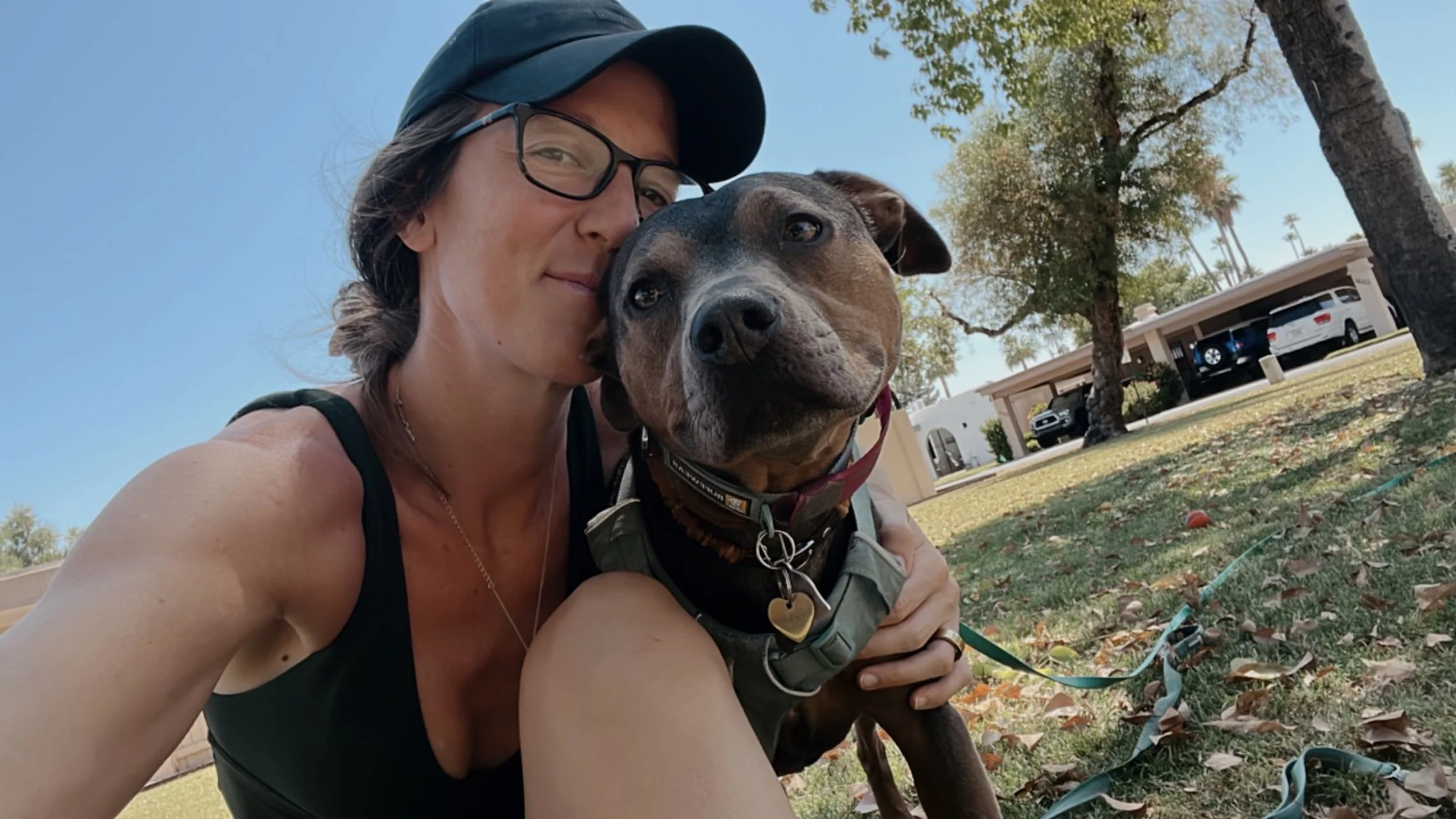 Elizabeth holding Luna in the desert, symbolizing strength and softness.