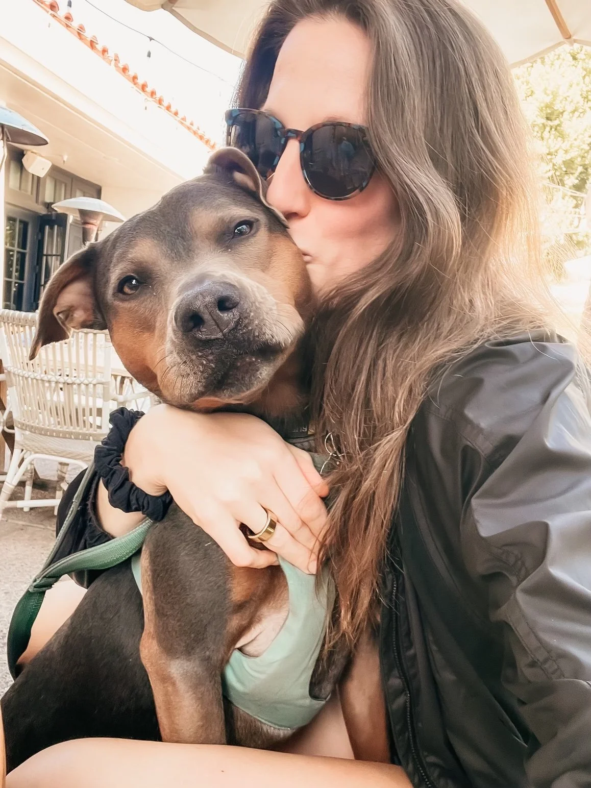 Dr. Elizabeth smiling outdoors with her dog Luna, reflecting on turning 37 and embracing integration and softness.