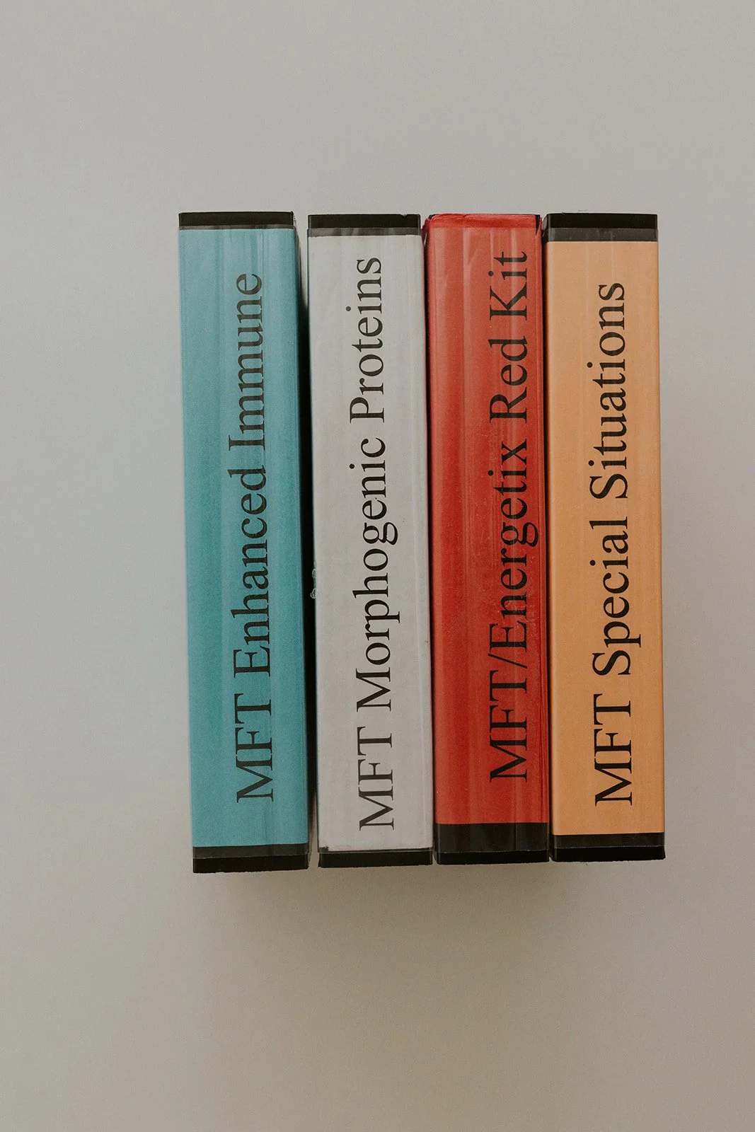 Morphogenic Field Technique test kits arranged upright on a neutral background, representing energetic assessment tools used in preventative healing work.