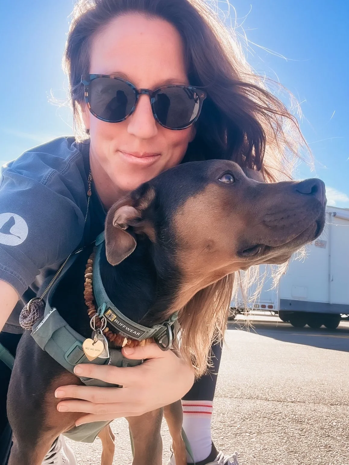 Dr. Elizabeth and Luna in bright sunlight, representing strength, protection, and transition into a softer season.