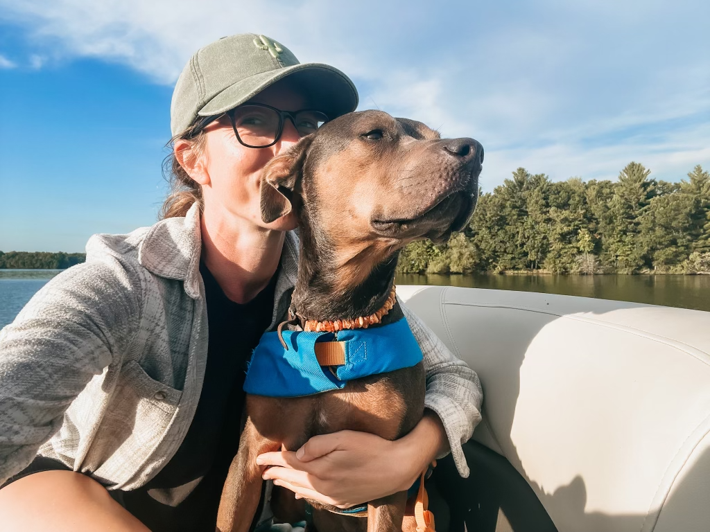 Dr. Elizabeth sharing an affectionate moment with Luna outdoors