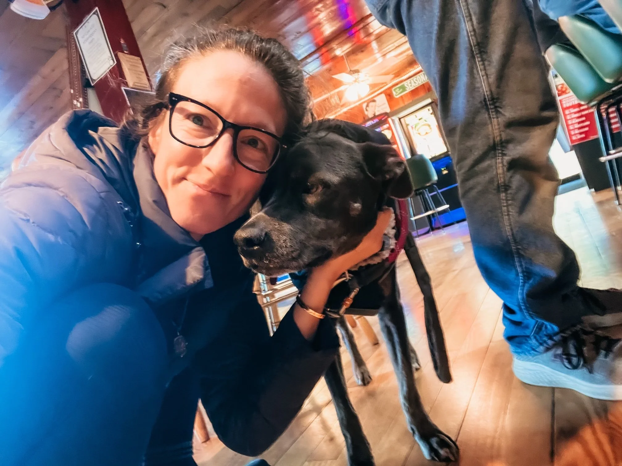 Dr. Elizabeth with Aurora indoors, reflecting on grief, growth, and embodied maturity at 37.