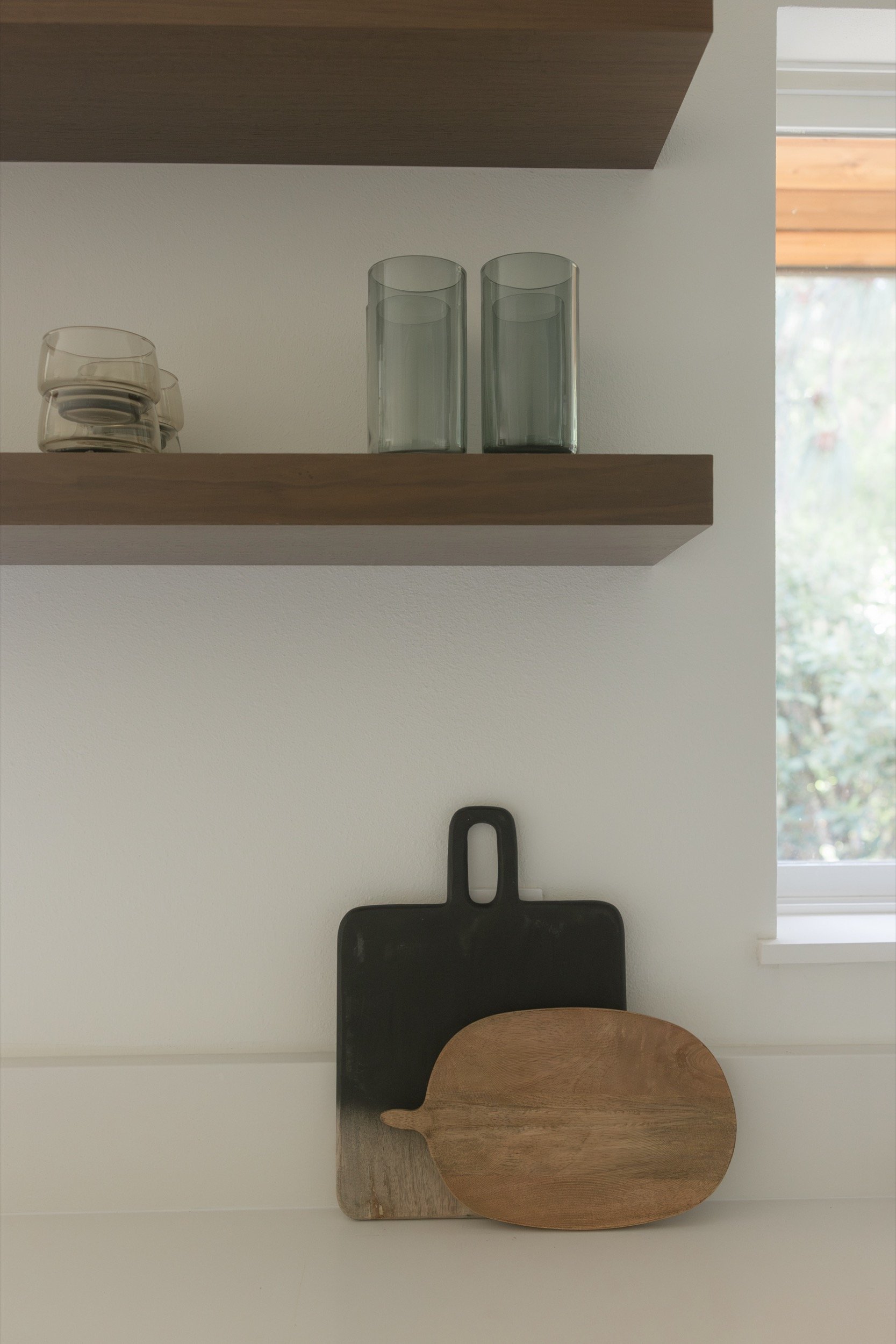 Floating walnut shelf in a remodeled Hood River kitchen
