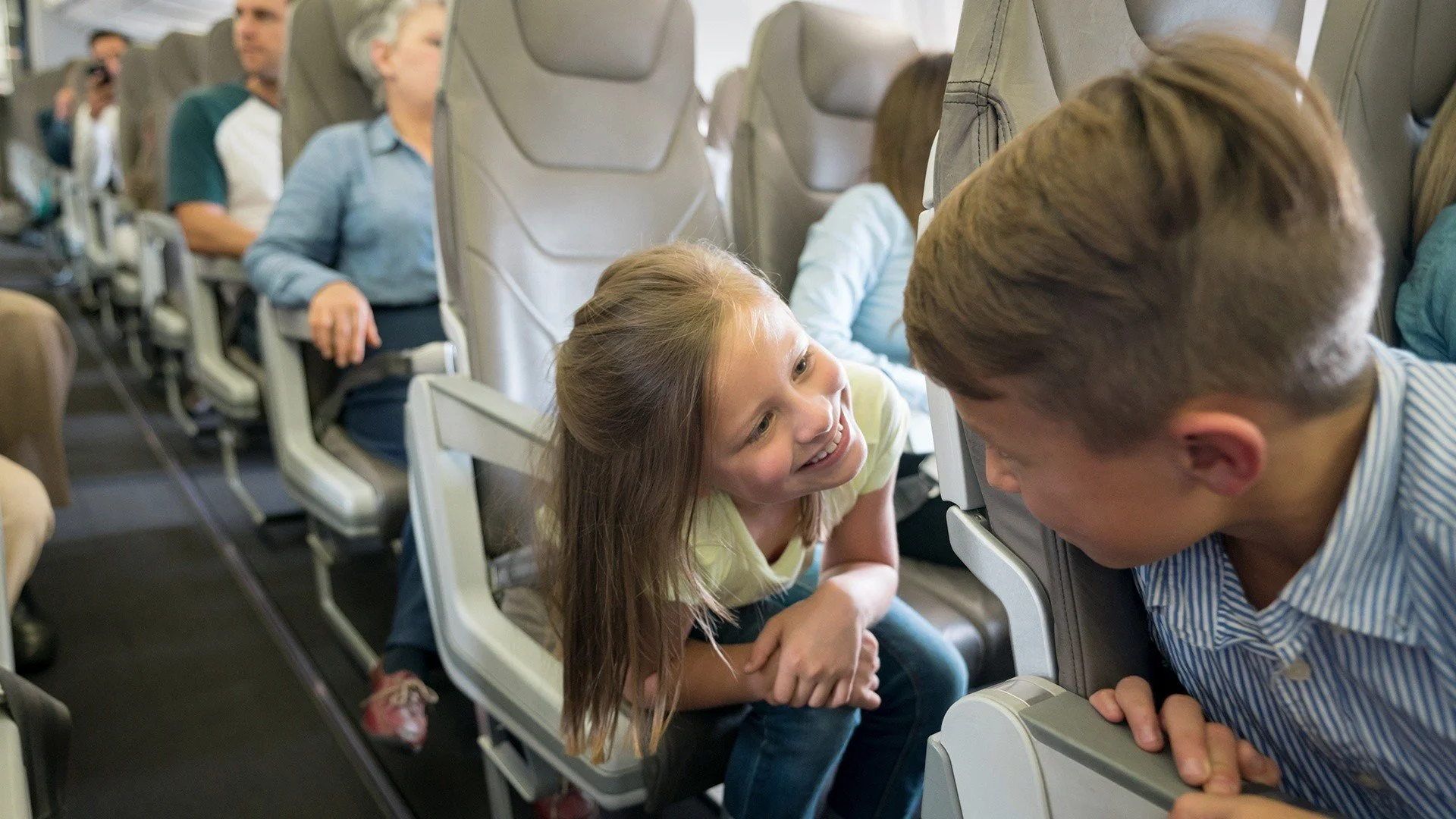 Kids sitting in aisle seat
