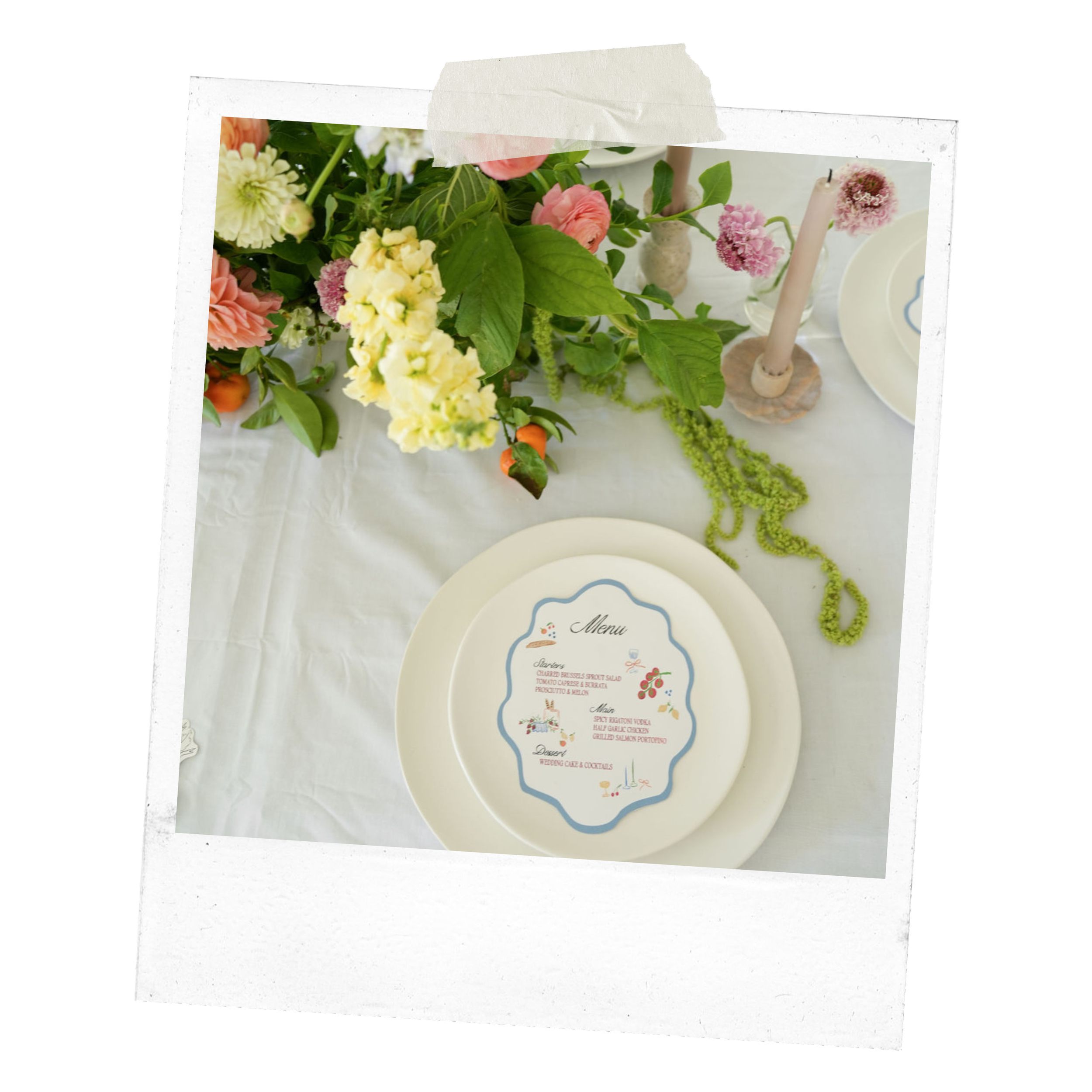 Elegant table setting with floral centerpiece and menu card on plate