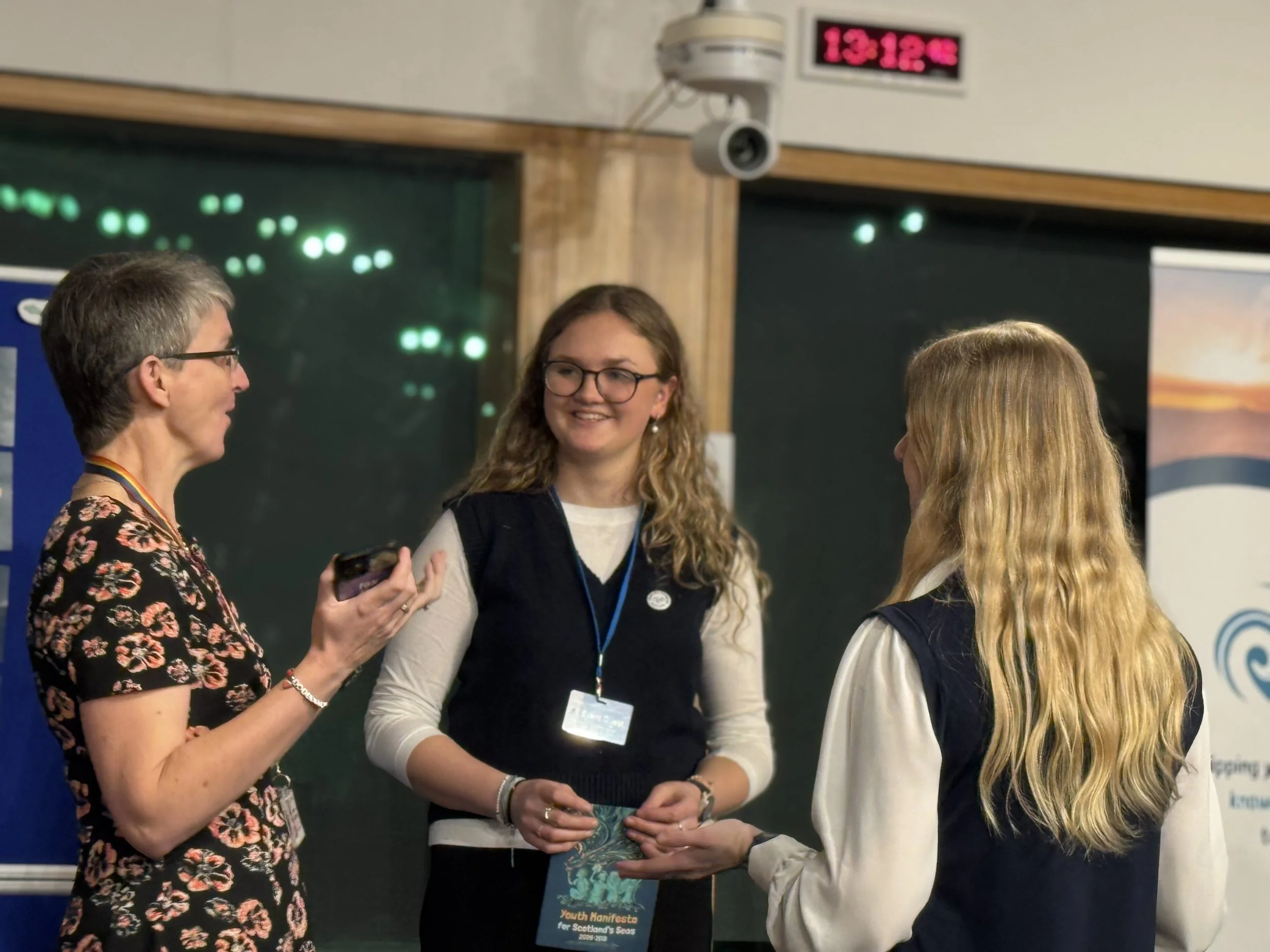 Maggie Chapman speaking with YSCS members Issie and Caitling
