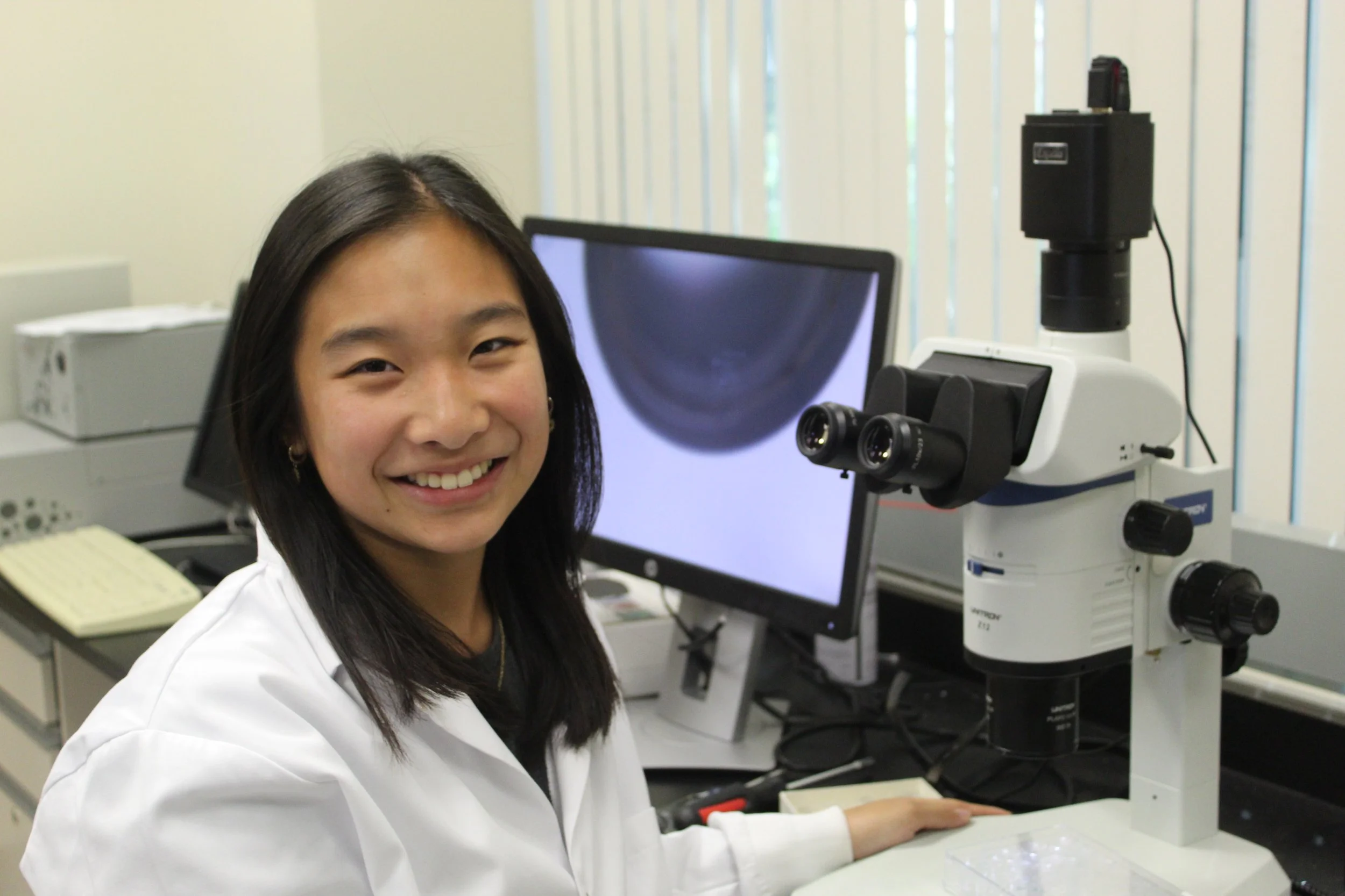 woman next to microscope