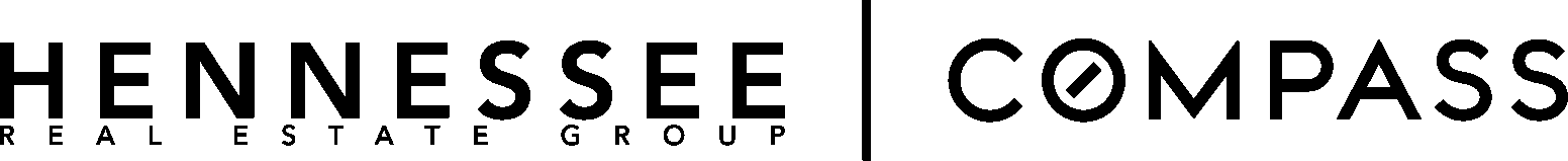 A person playing the guitar in a room with speakers.