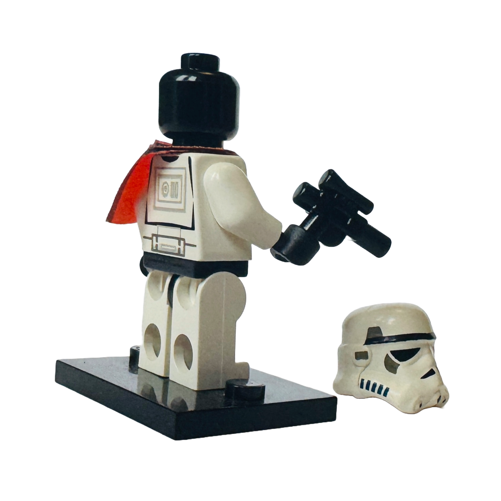 4.	Rear view of LEGO Sandtrooper Minifigure (sw0199) with helmet off, clearly showing detailed back torso print and accessory.