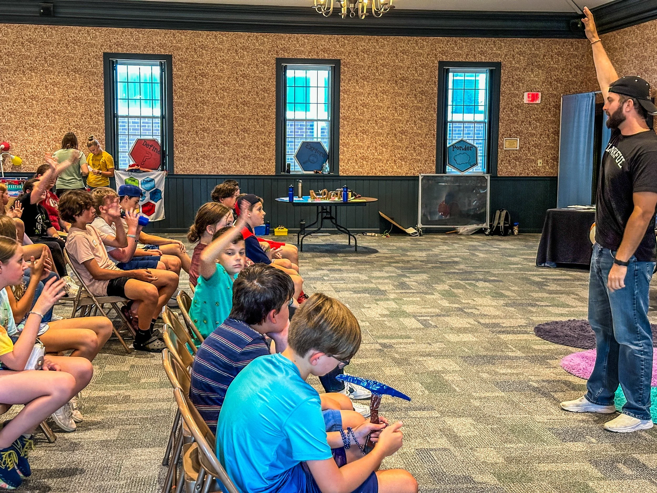 Delivering a workshop to middle schoolers at a TomTod Camp What-If Pitch Competition Day