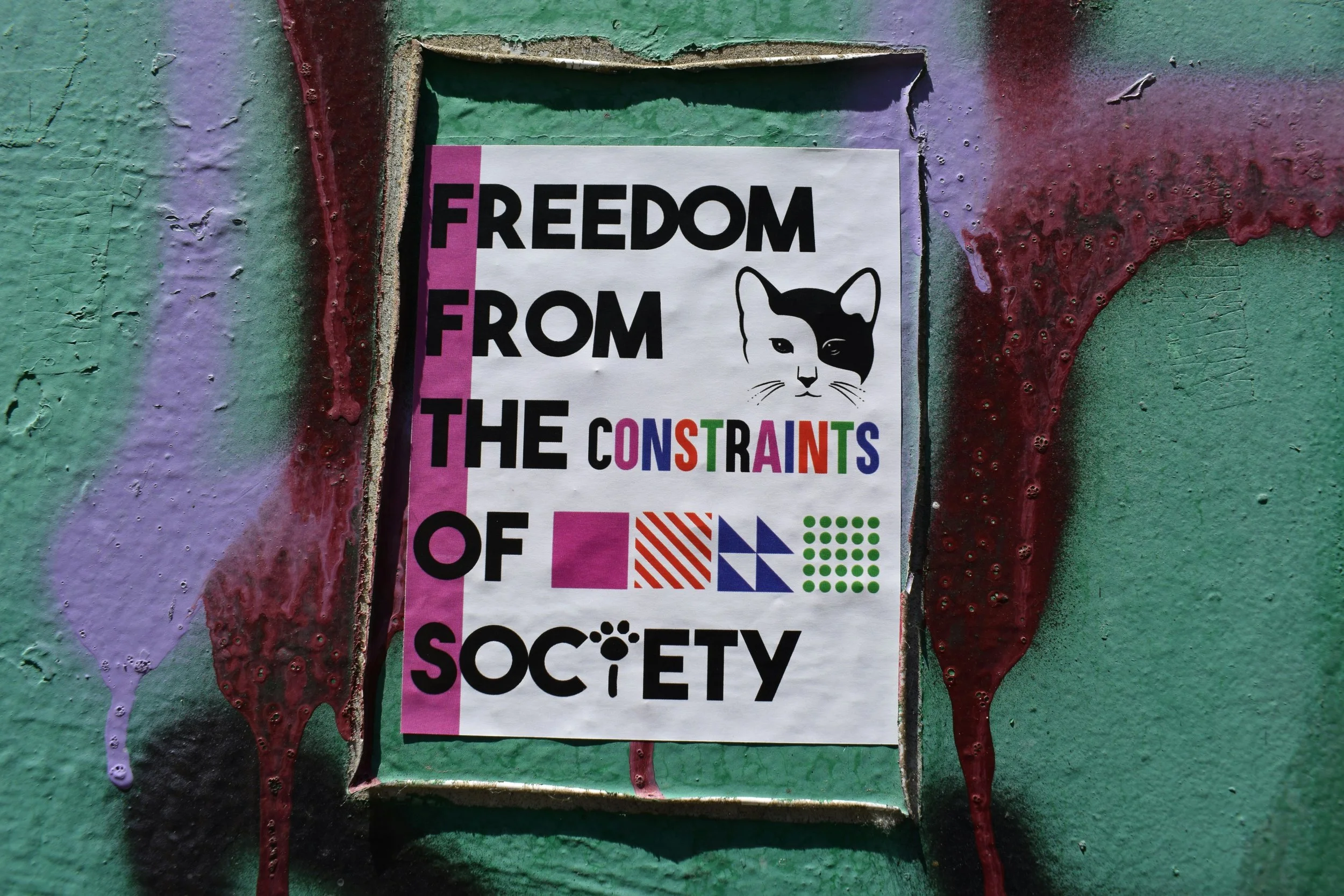 A sign that reads "Freedom from the constraints of society"