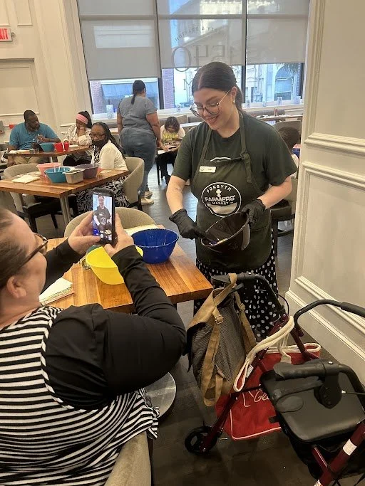 Leigh Beeler presents a cooking demonstration for a 2025 Food Farmacy participant.