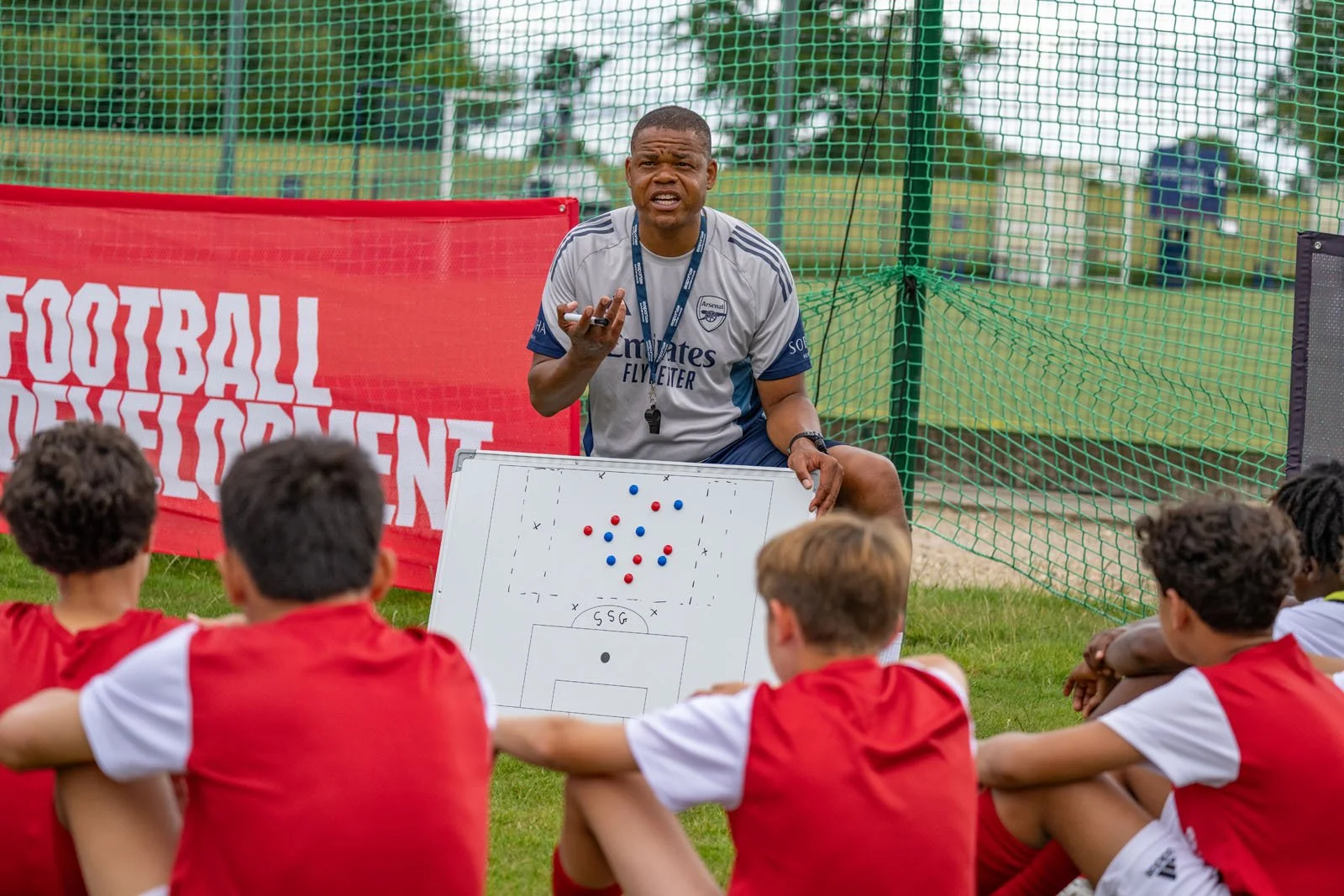 A coach delivering a tactics session.