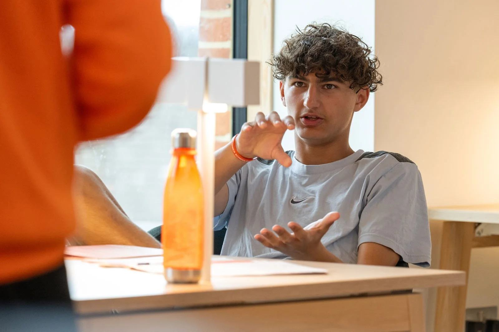 A student speaking in an English class.