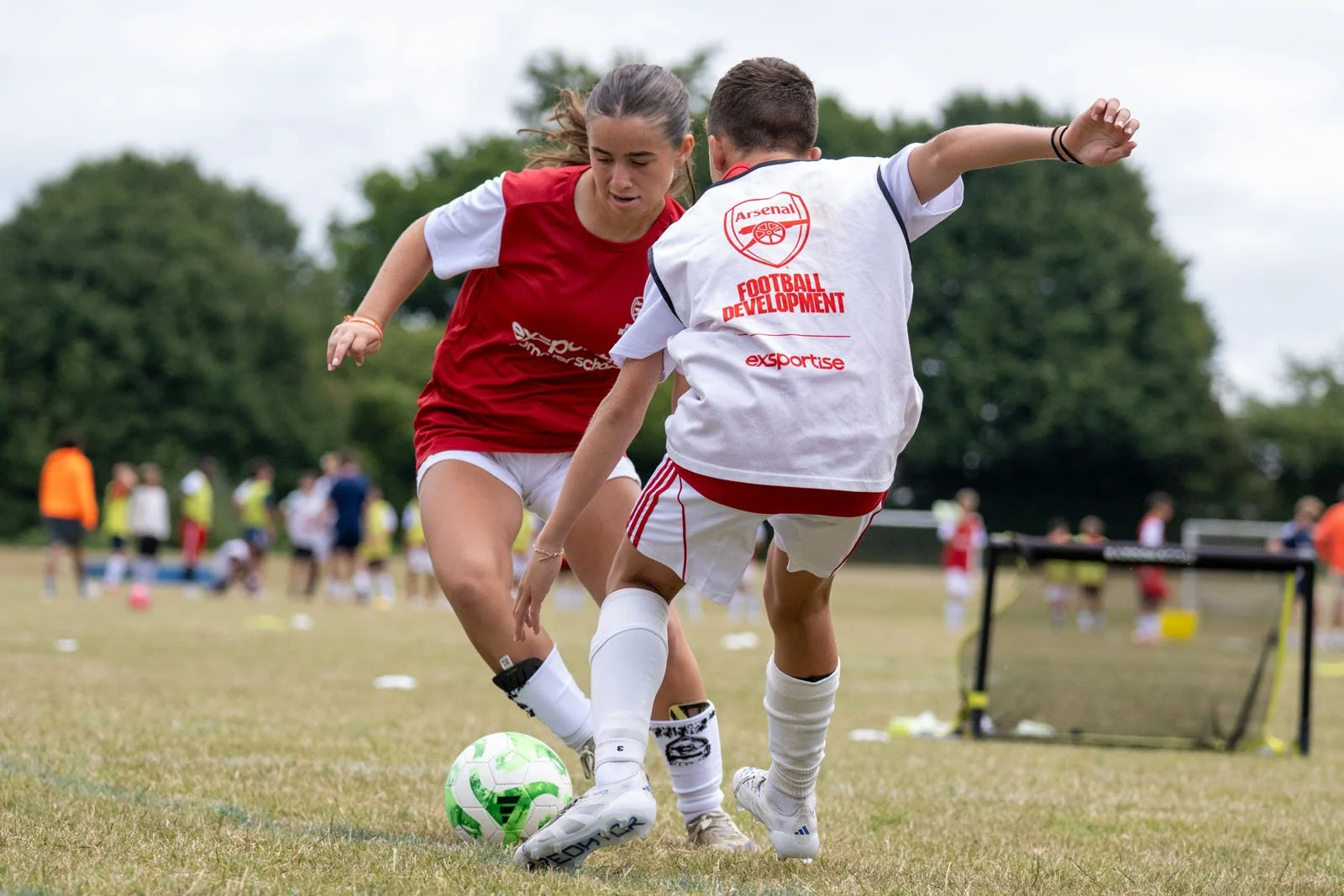 One on one skills session at an Arsenal camp.