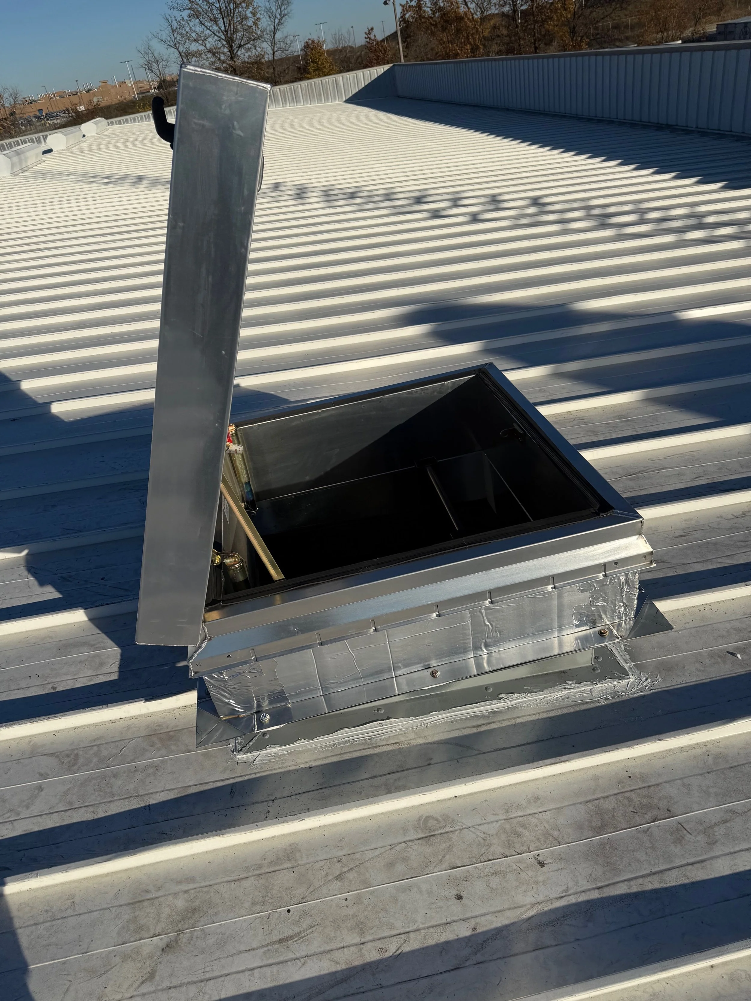 WE DESIGNED THE RTU CURB AND INSTALLED THE HATCH