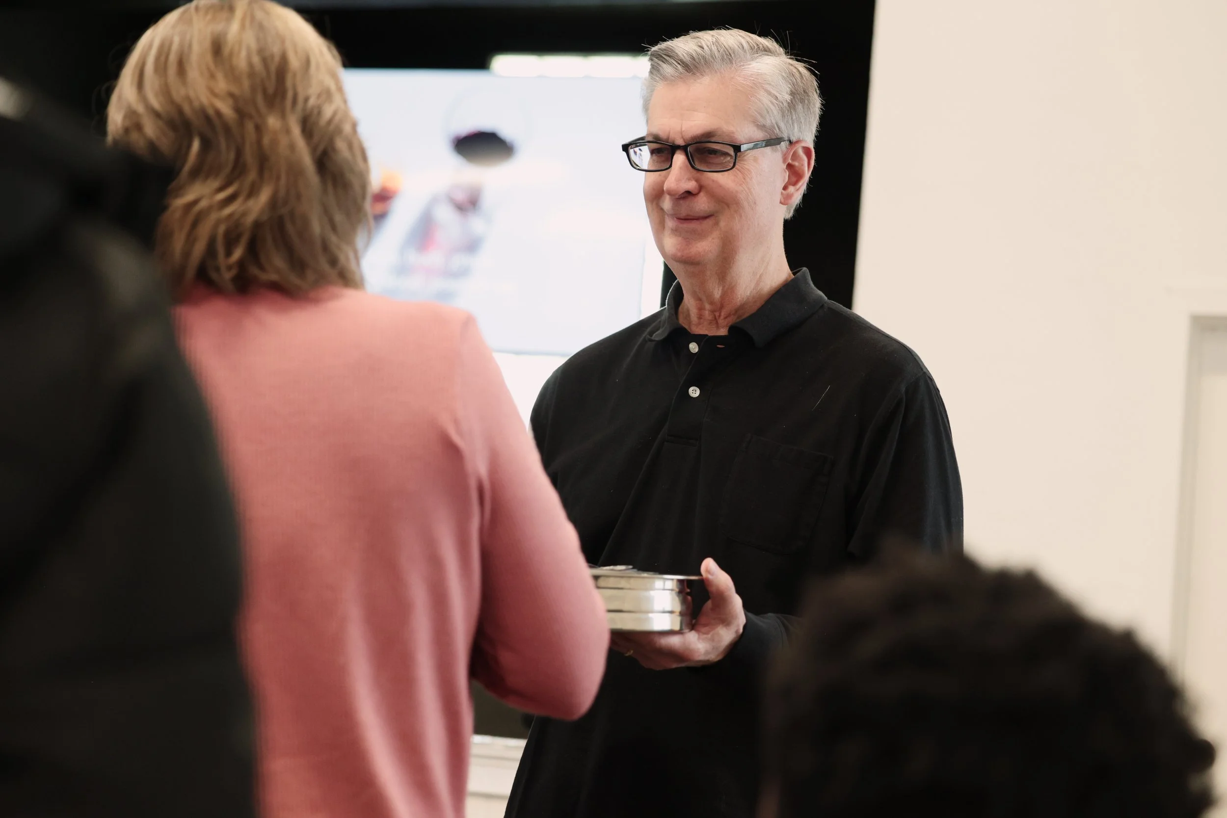 Pastor serves communion to the congregants