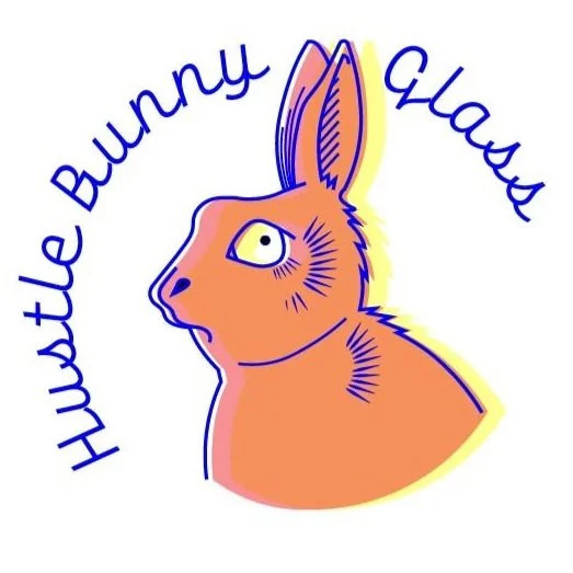Stylized illustration of a bunny with text that says 'Hustle Bunny Glaze' surrounding the bunny's head.