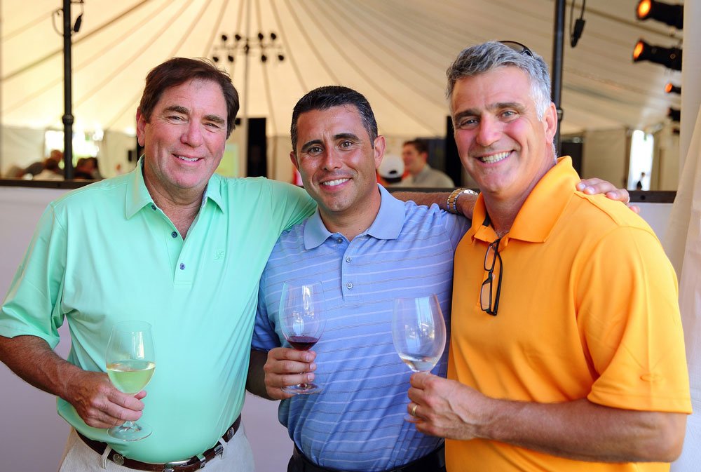 Golfers enjoying wine at Schulz Golf Classic fundraiser