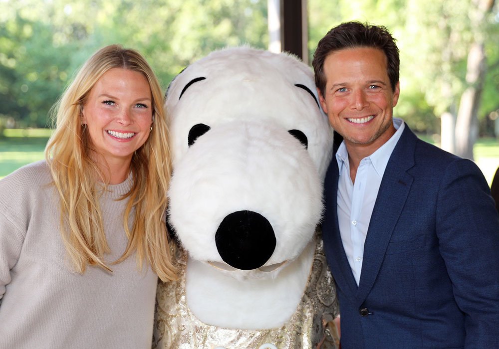Actor Scott Wolf and his wife with Snoopy at the Golf Classic