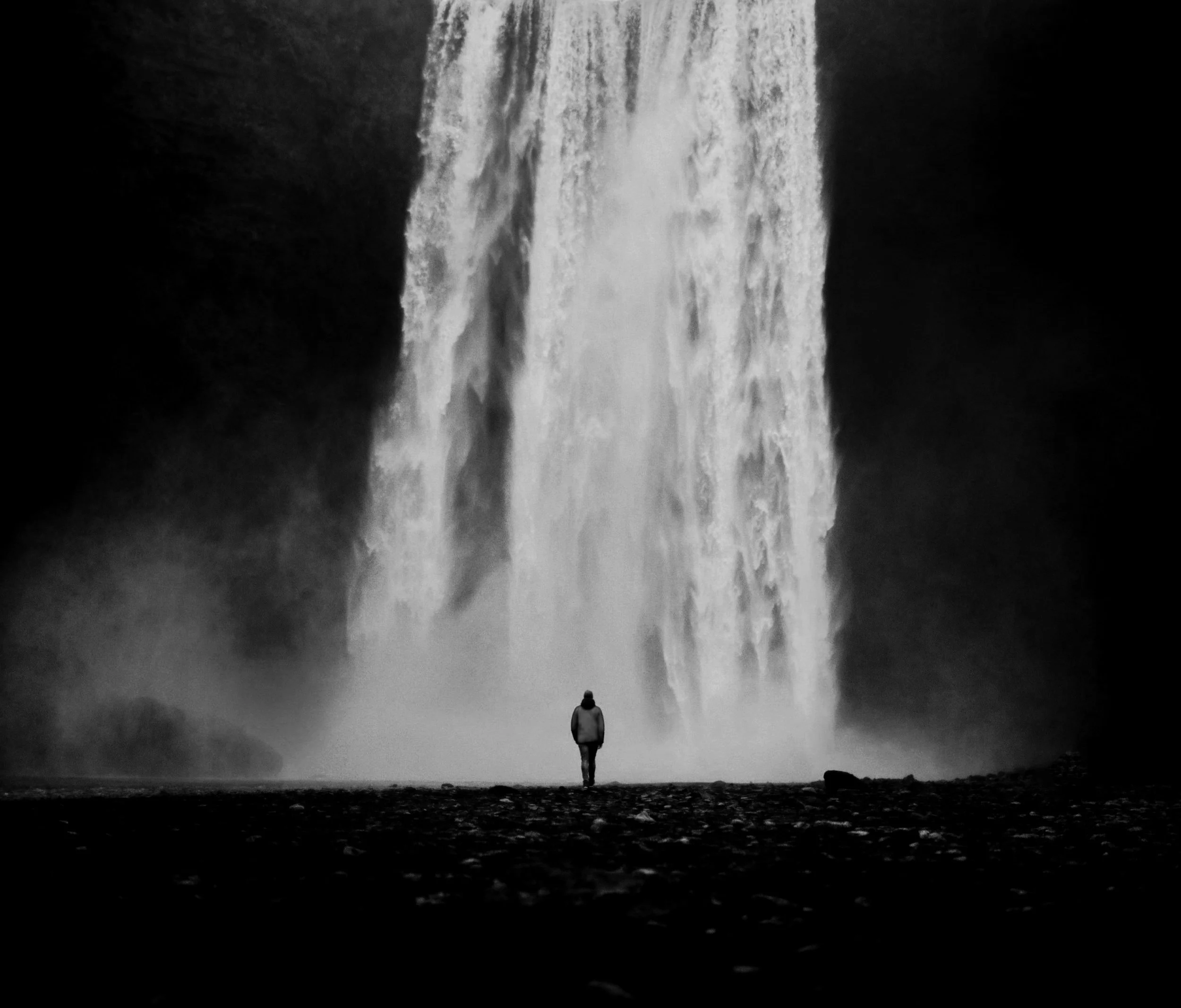 Icelandic waterfall and one person