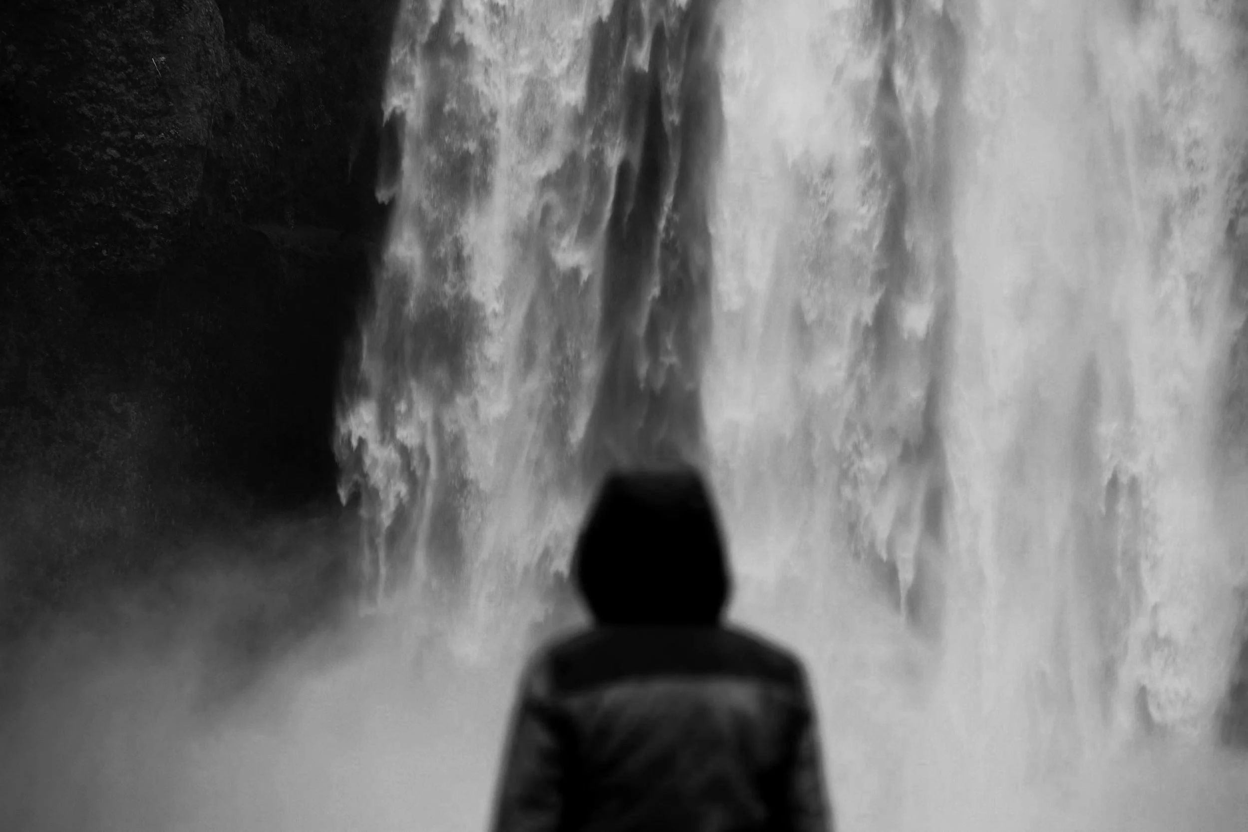 Icelandic waterfall and one person