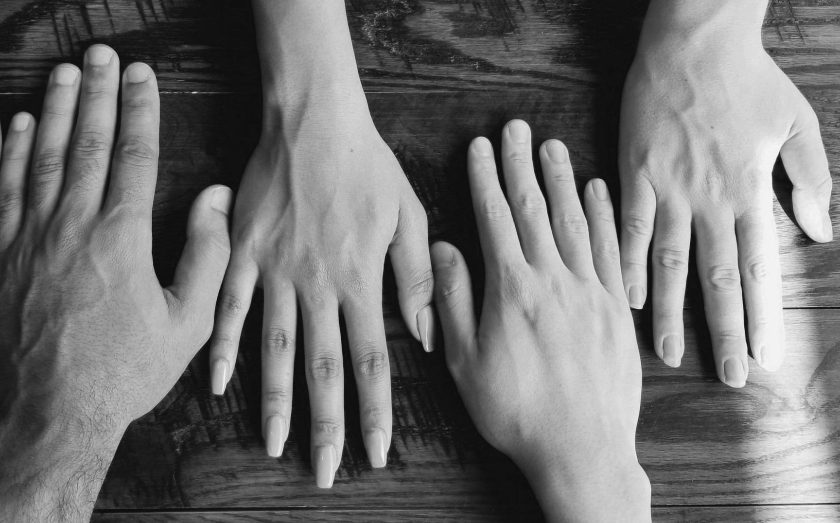 Four hands on the table