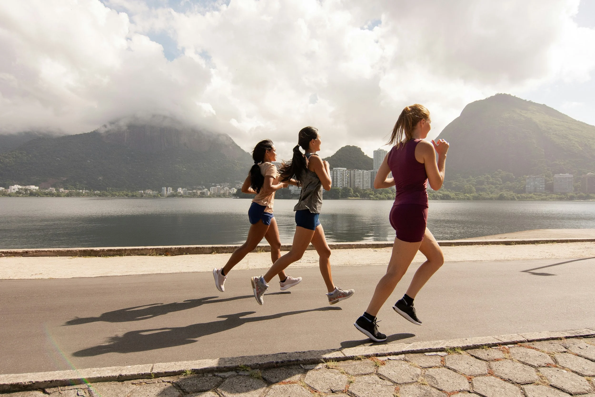 Three running girls in a row