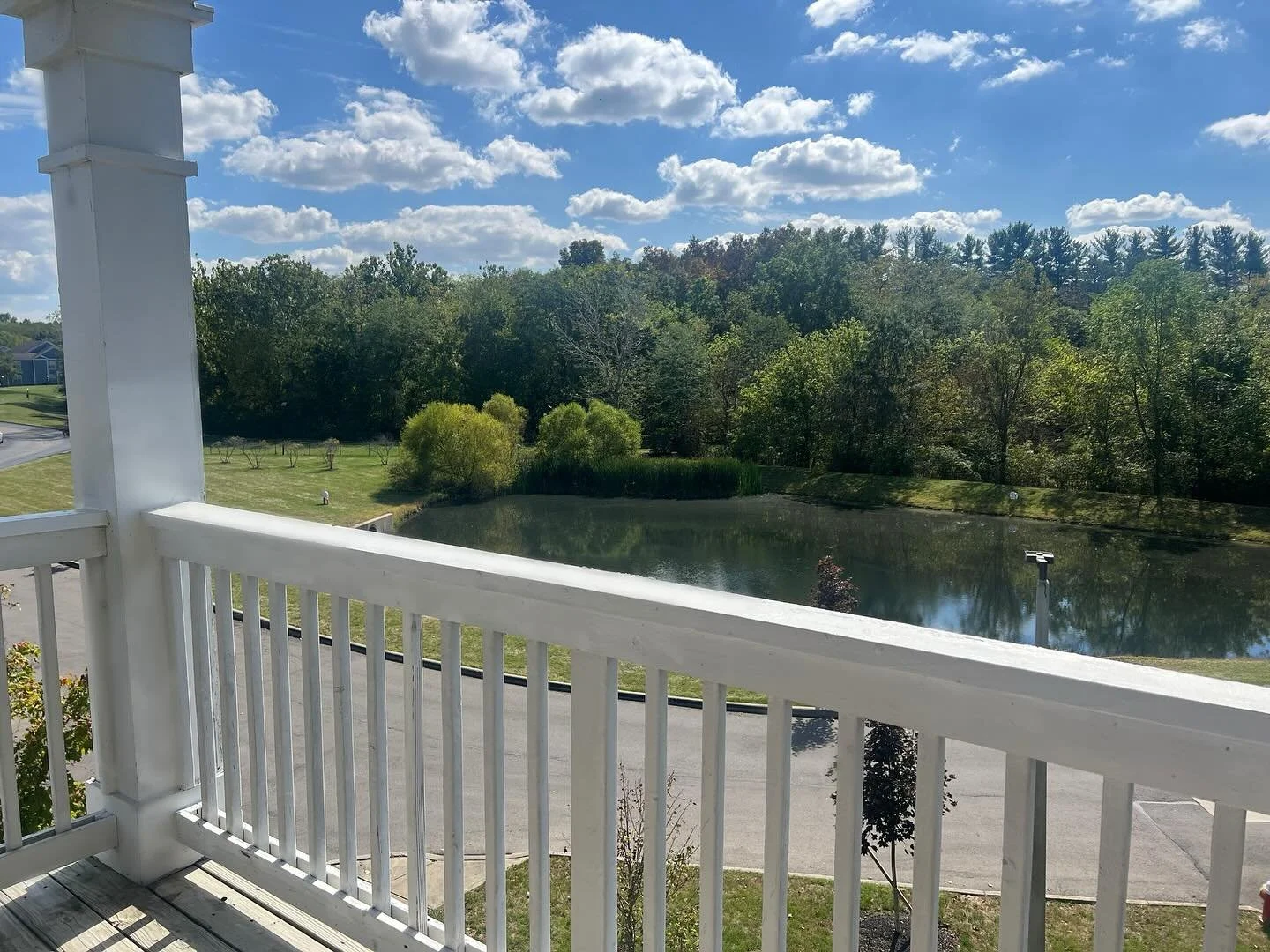 Take in the stunning view from your patio at Sugar Run! Our selection of 2- and 3-bedroom homes offer breathtaking scenery from our balconies—perfect for unwinding and relaxing after a long day. 🌲🤩