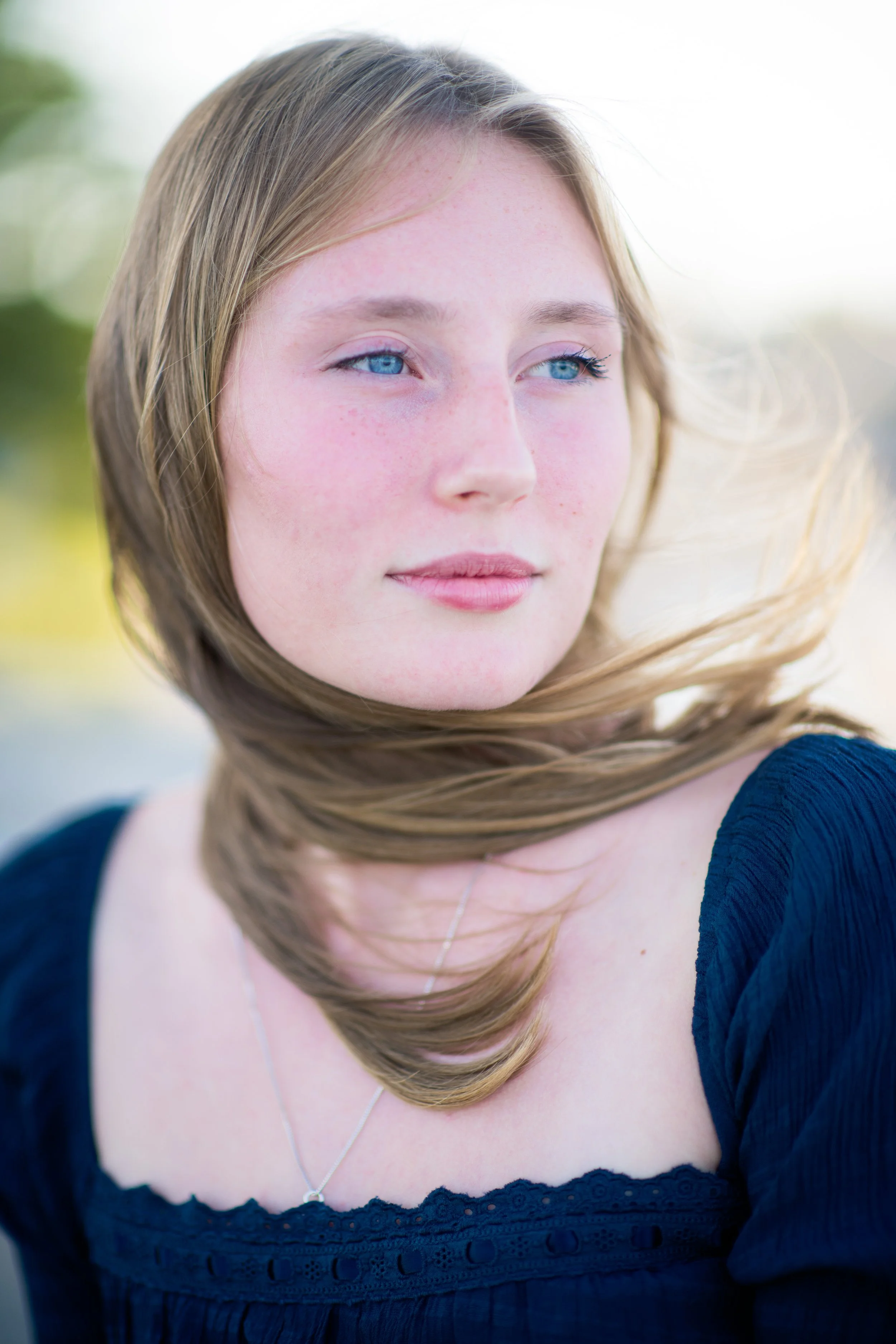 senior girl blue eyes windy day.jpg