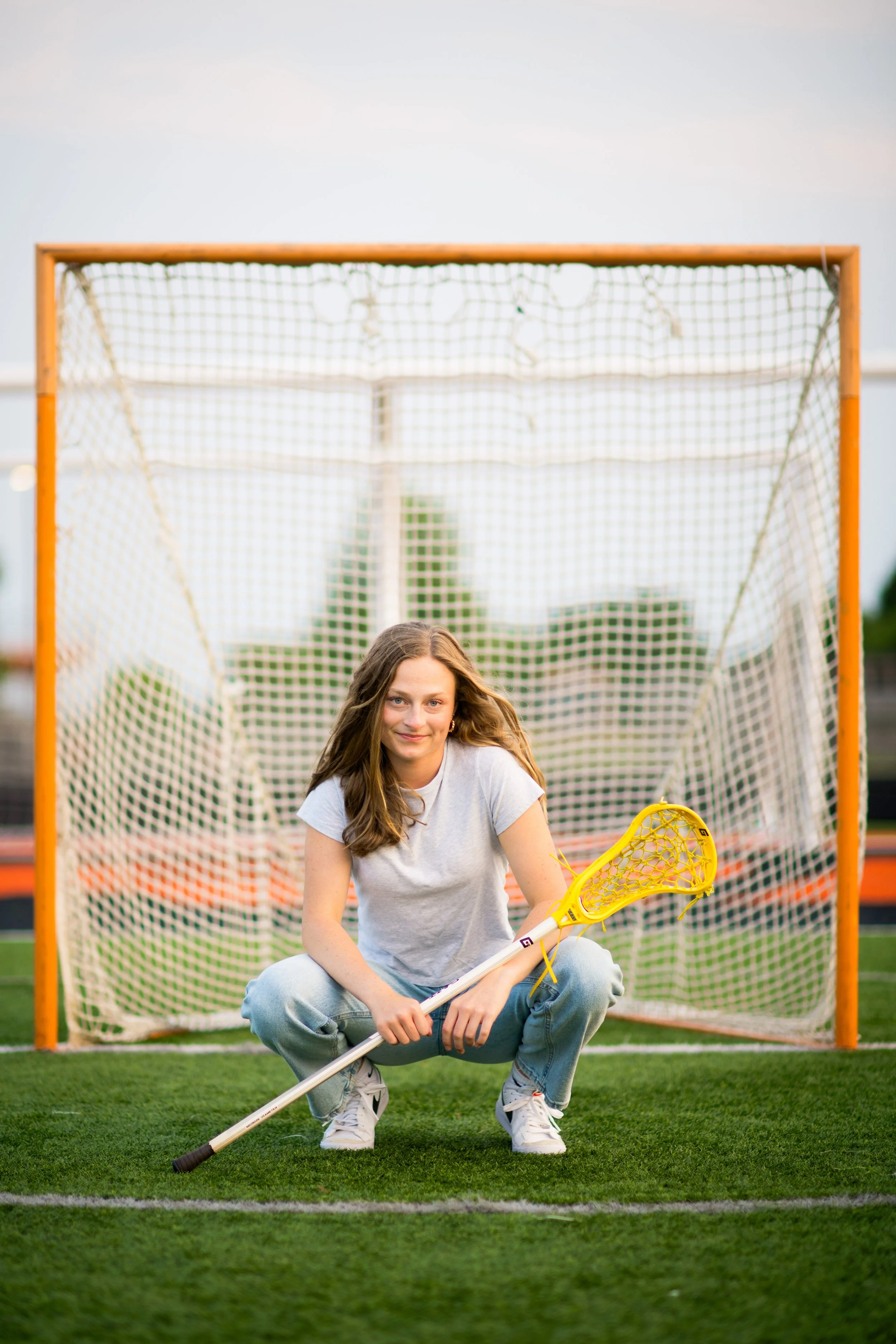senior lacrosse girl goal net stick.jpg