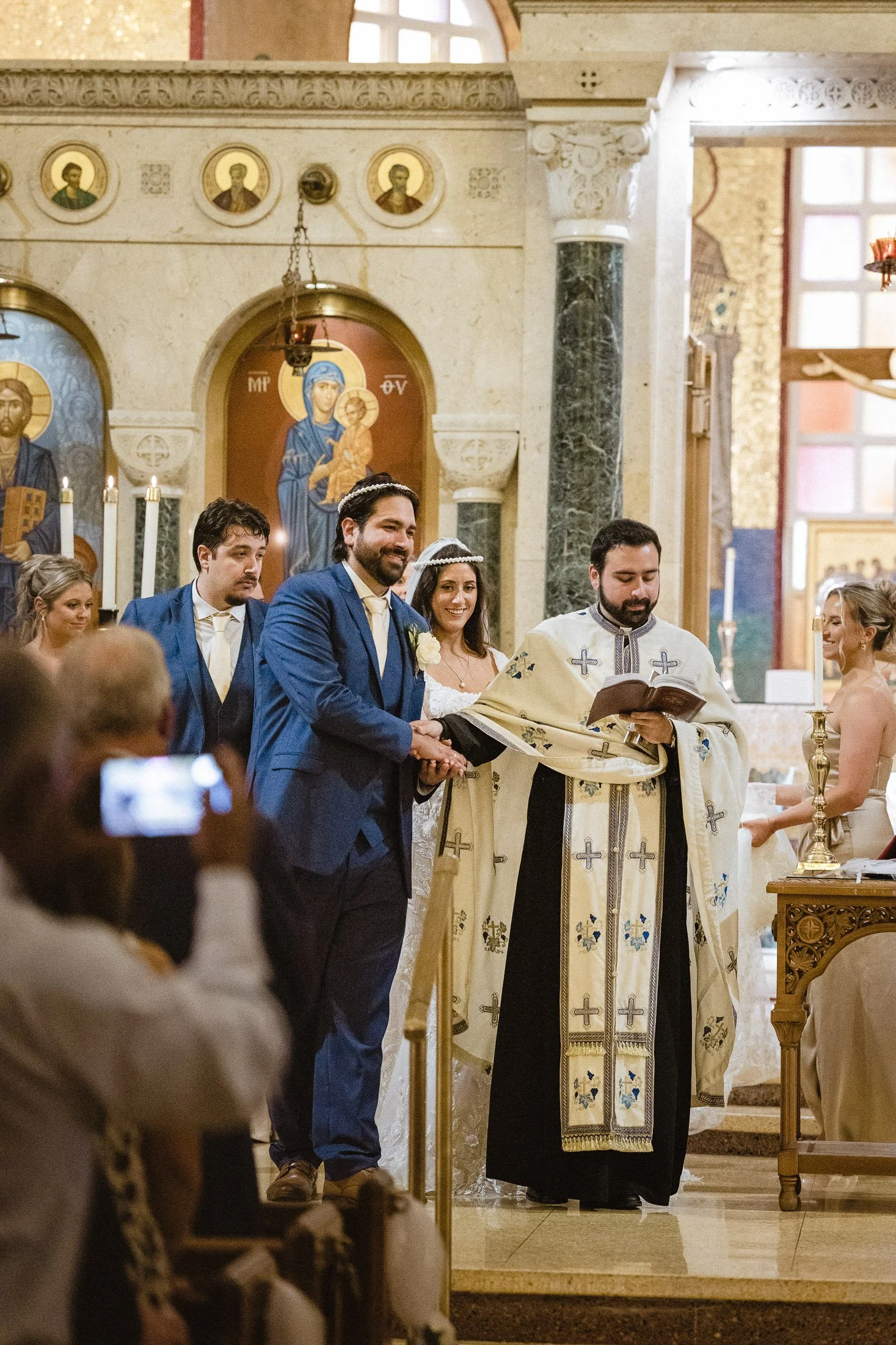 Traditional Greek Orthodox wedding ceremony moment during church service at Saint Sophia Greek Orthodox Cathedral