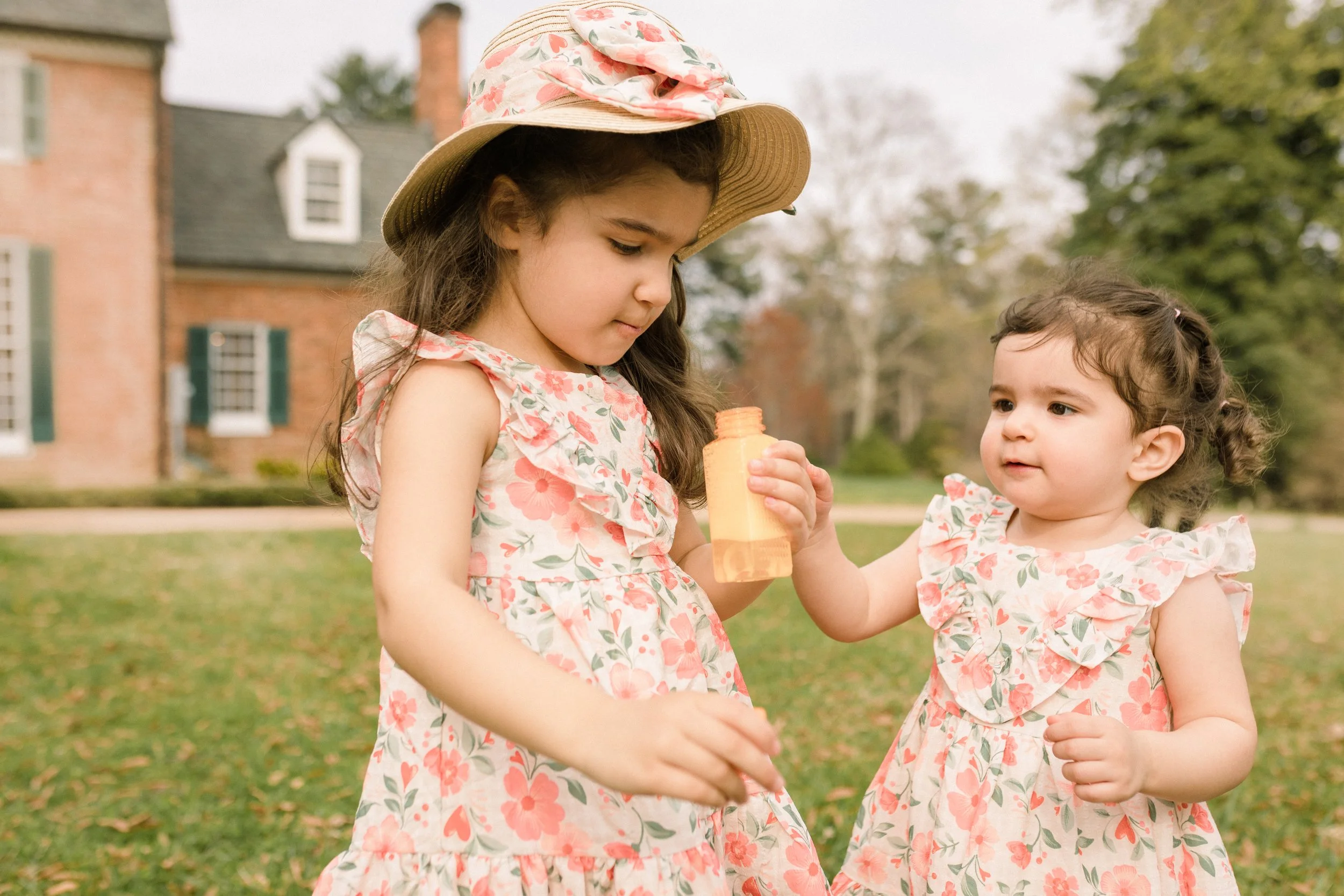 Sisters playing at Green Spring Gardens in Alexandria, Virginia — spring family photography by Amanda Kahnell