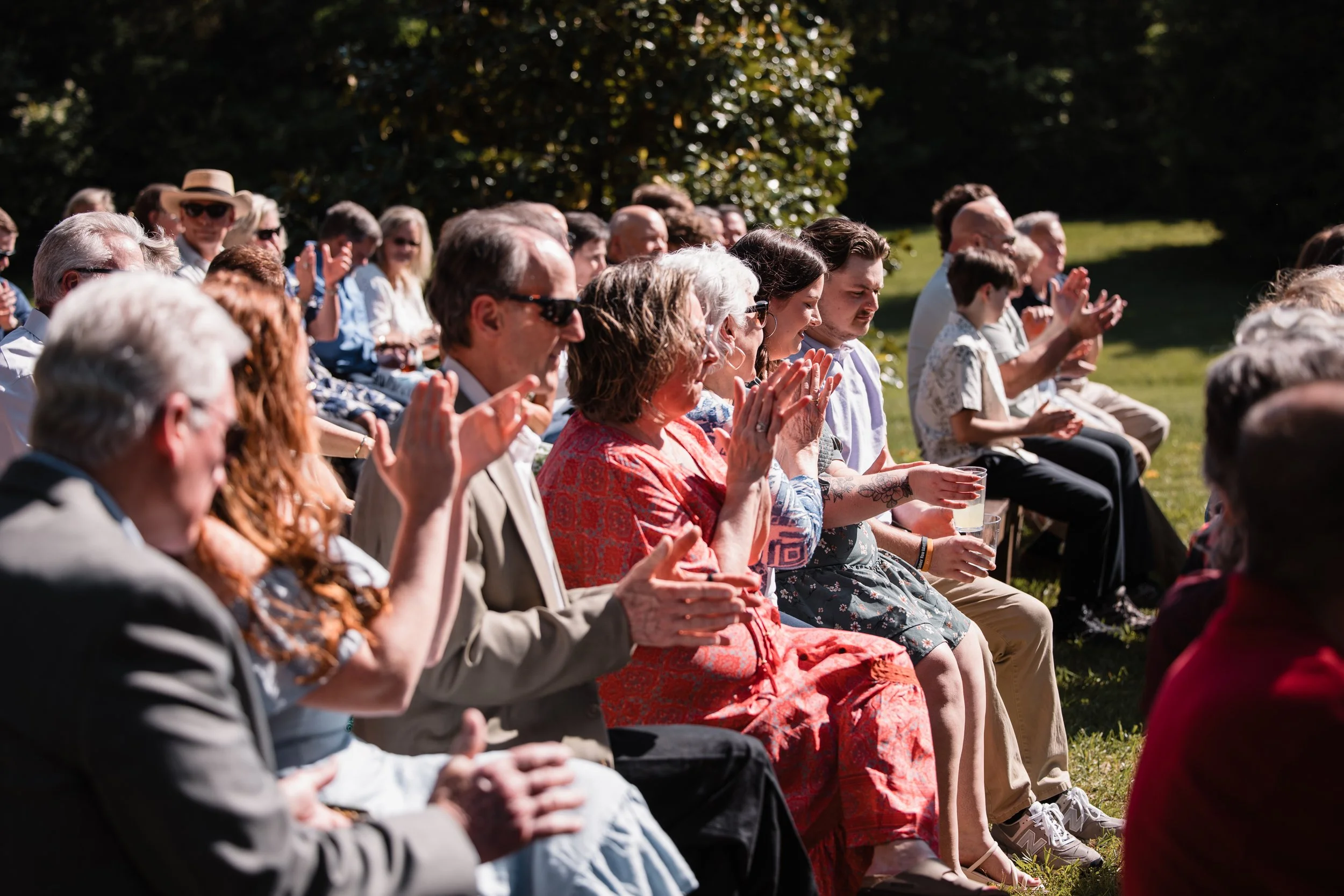 persimmon-creek-barn-wedding-guests-applauding-ceremony.jpg