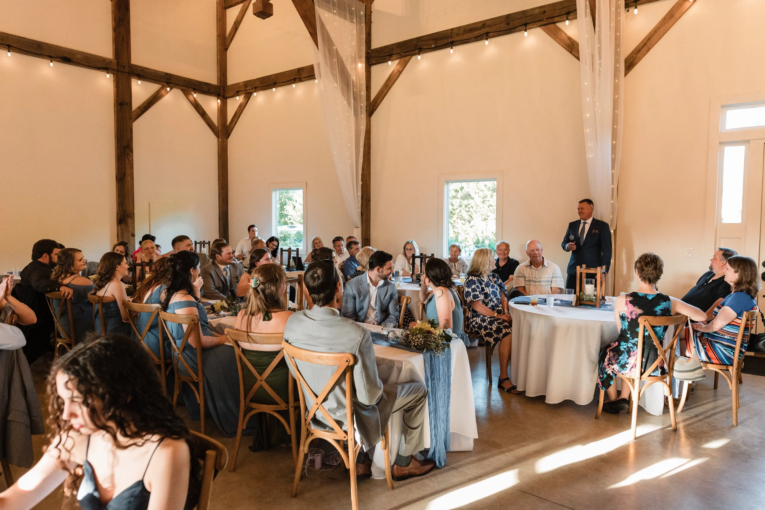 caitlin-johnathan-persimmon-creek-barn-wedding-reception-toast.jpg