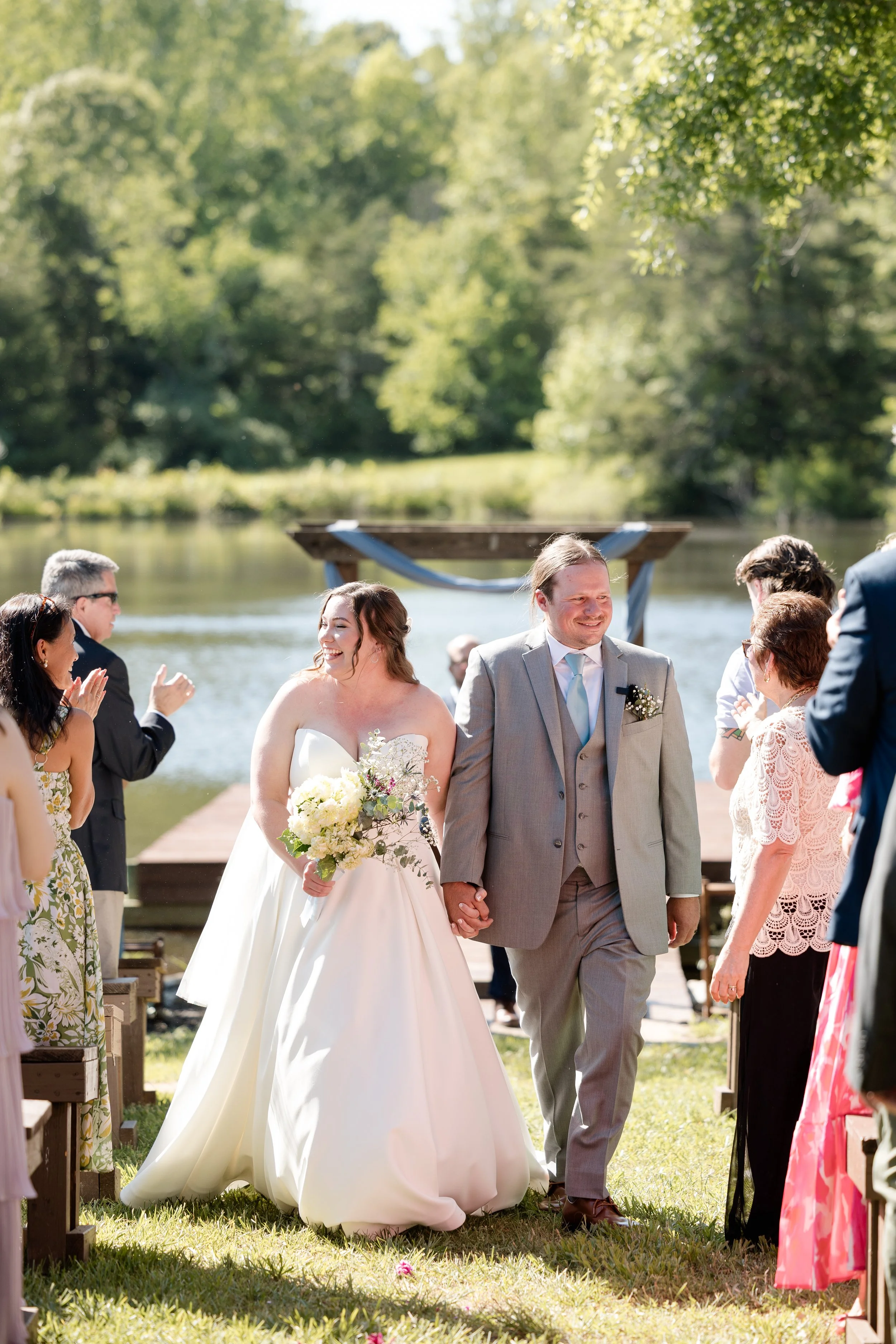 Bride and groom walking down isle after saying i do at Persimmon Creek Barn, VA.