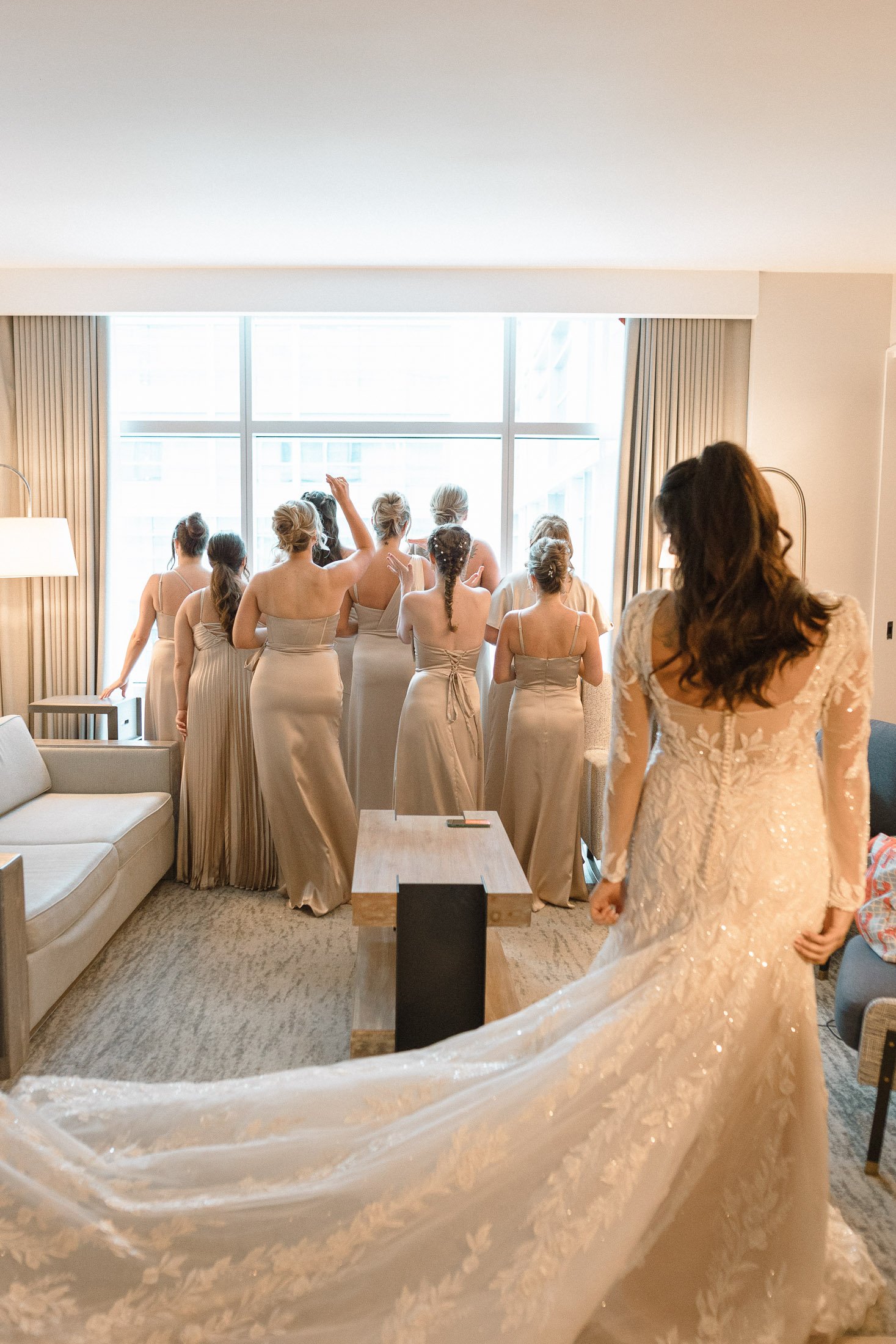 Bride standing with bridesmaids during getting ready moments before wedding ceremony in Washington DC
