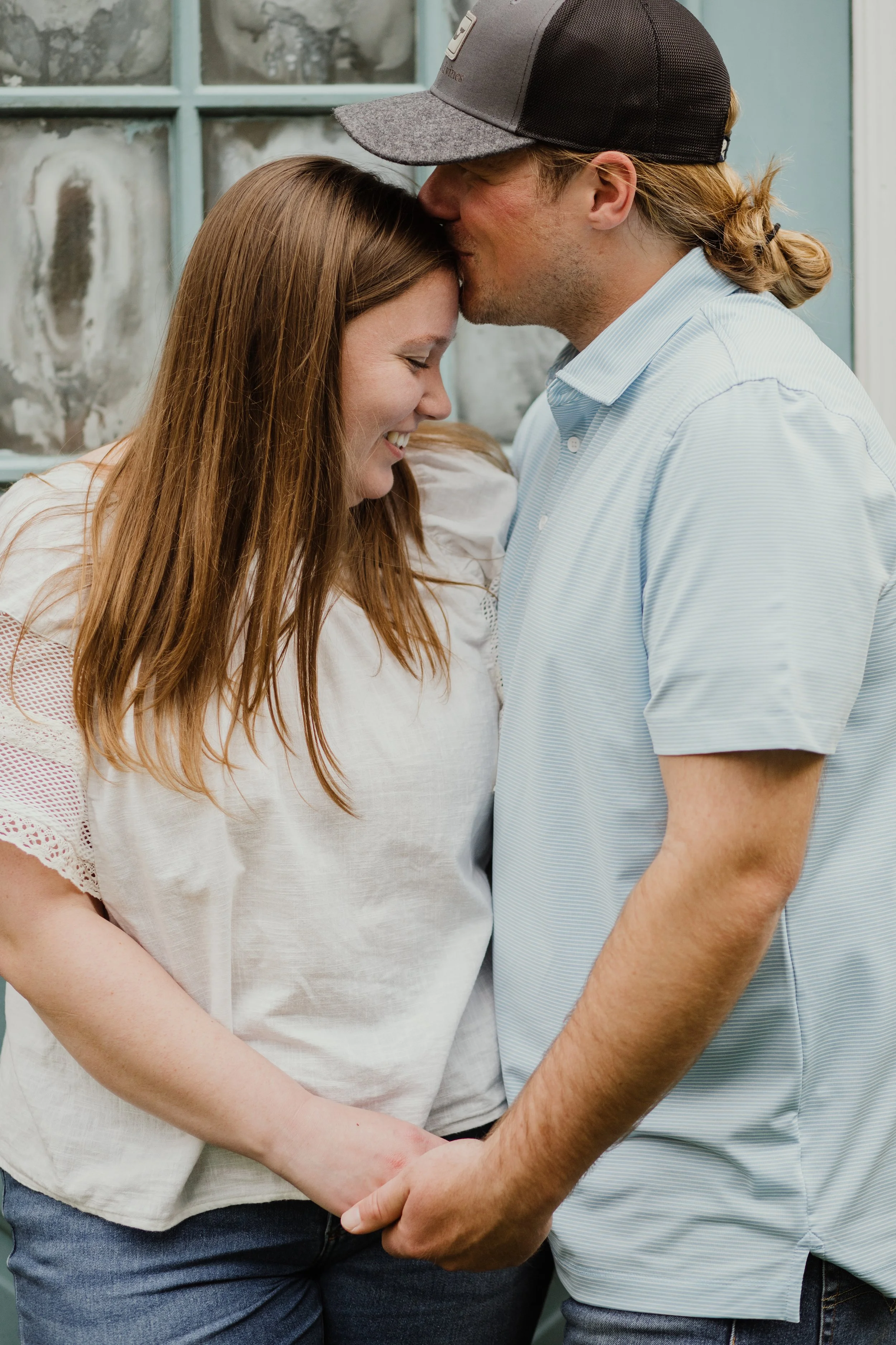 Couple holding hands during a romantic engagement session in Alexandria, Virginia at Green Spring Gardens.