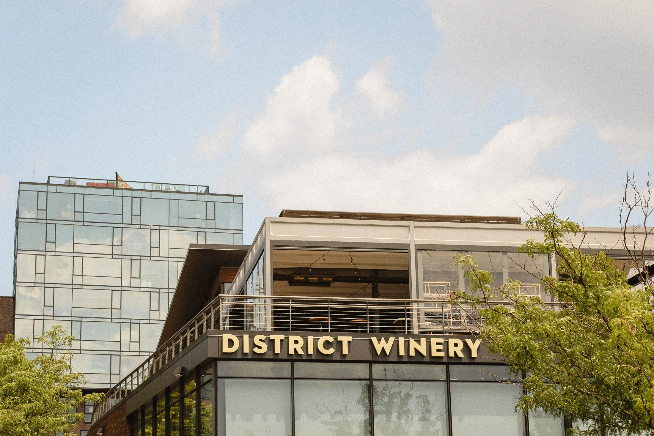 Exterior view of District Winery wedding venue along the waterfront in Washington DC