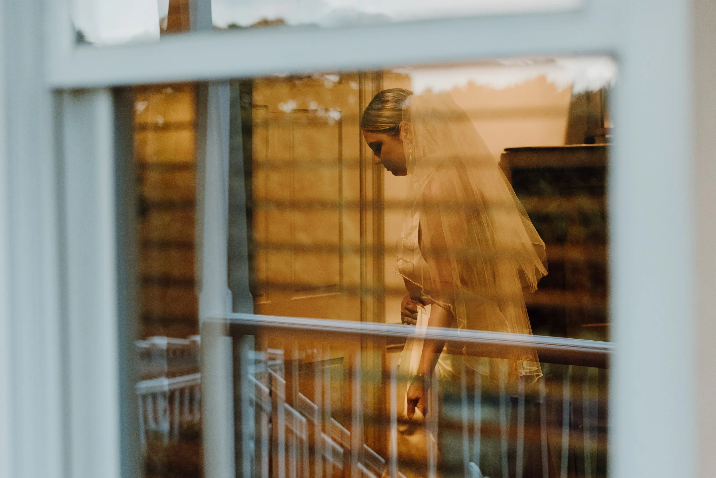 bride taking an inimate moment alone riverside on the potomac