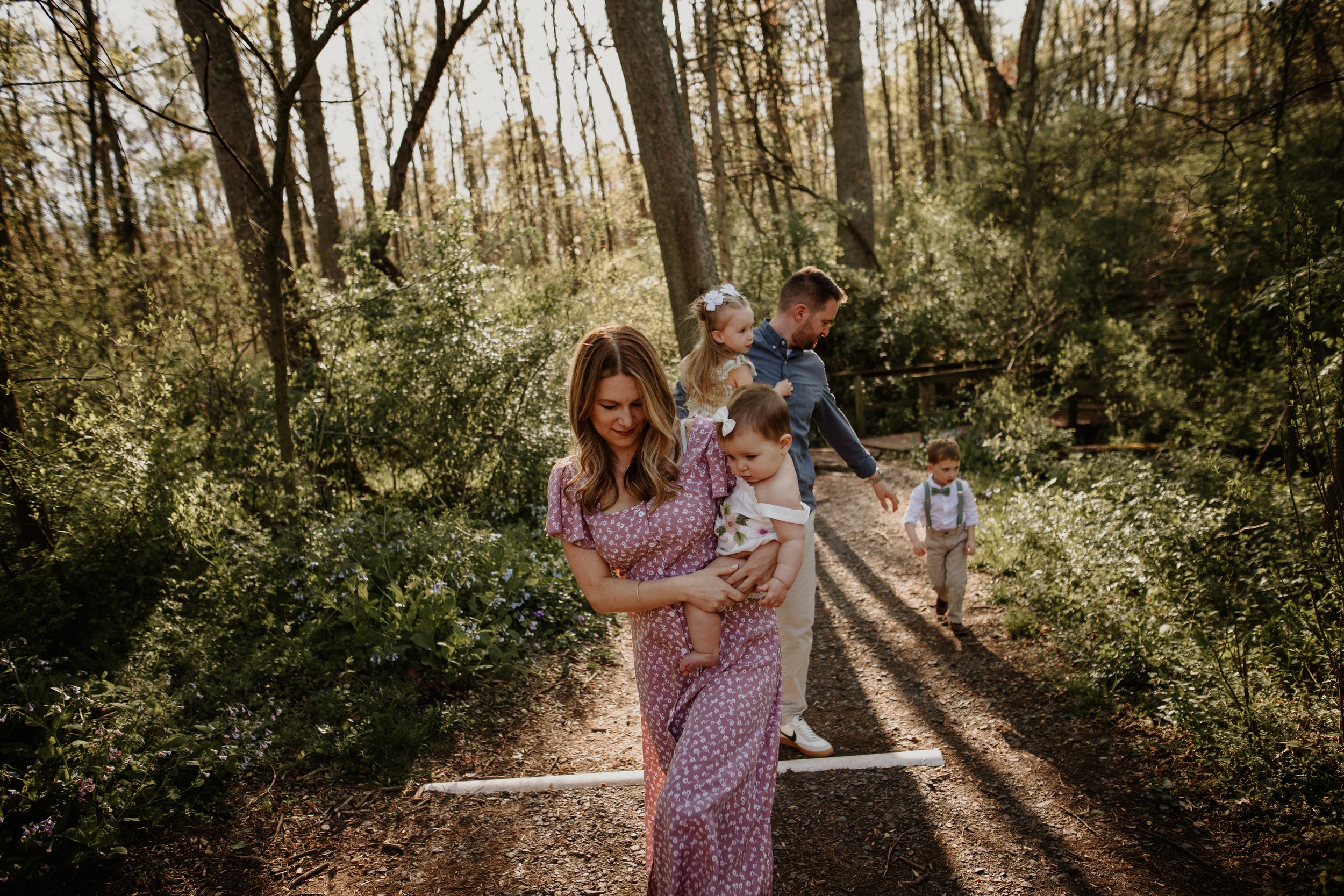 Family walking through bluebell woods at Ellanor C. Lawrence Park in Chantilly, Virginia — spring family photography by Amanda Kahnell